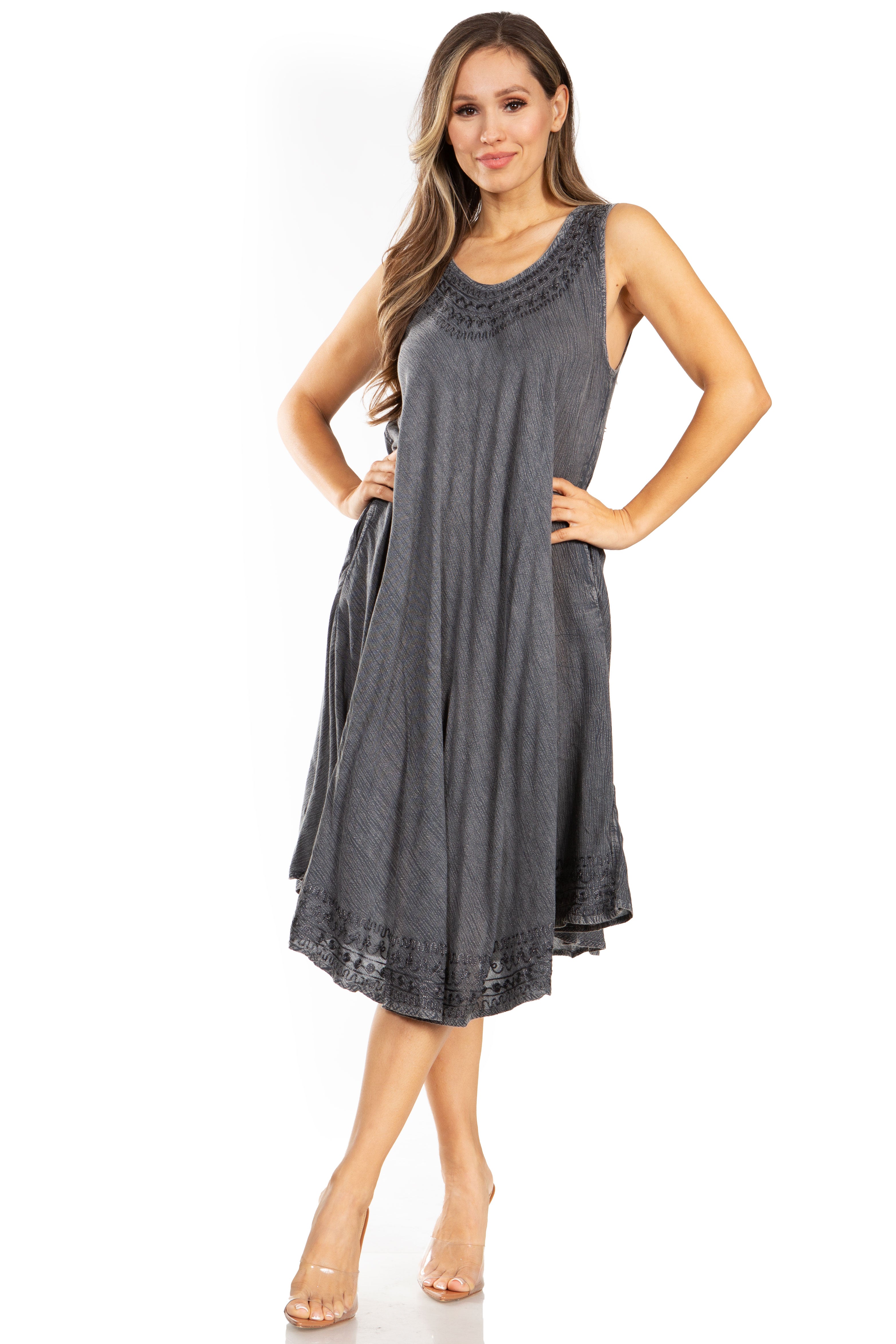 Woman wearing a gray sleeveless dress on a white background