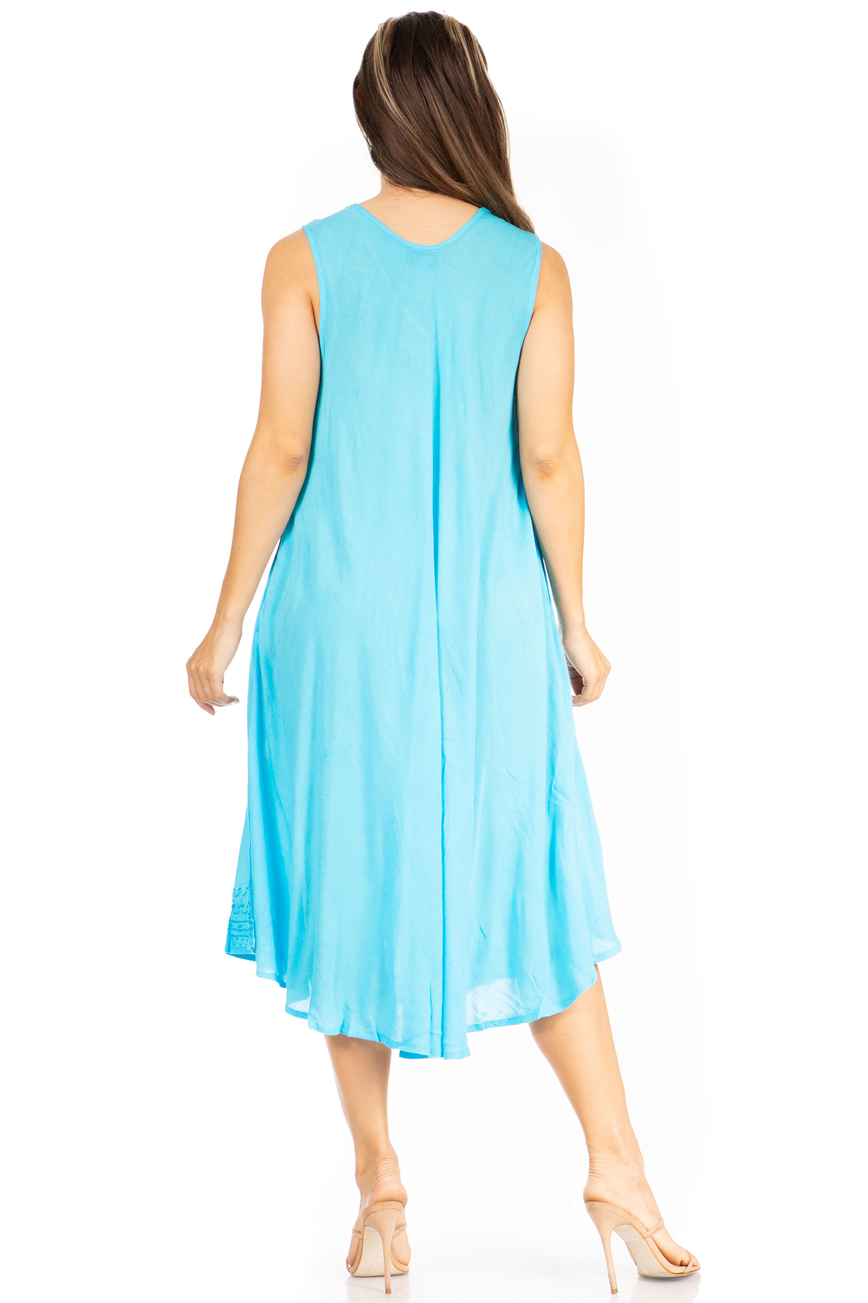 Woman wearing a light blue sleeveless dress on a white background