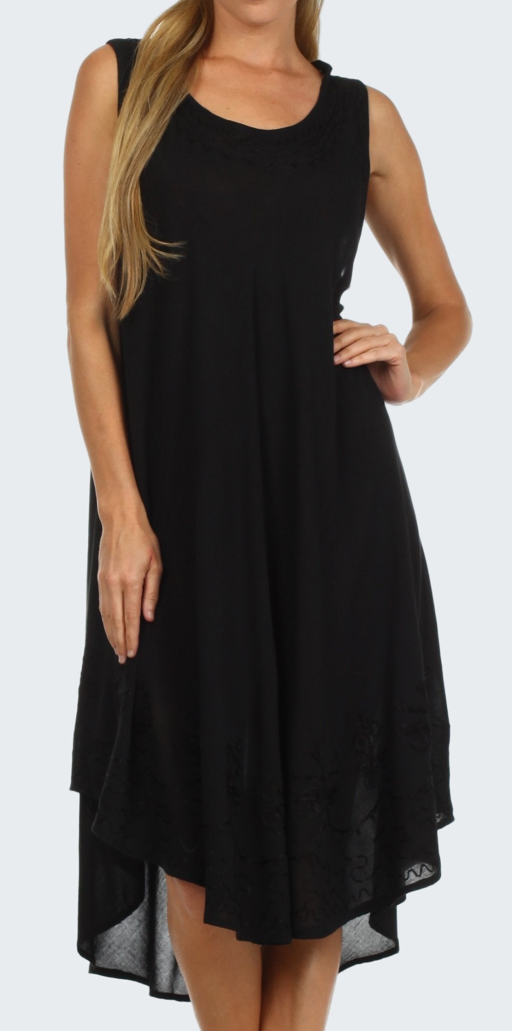 Black sleeveless dress worn by a model on a white background