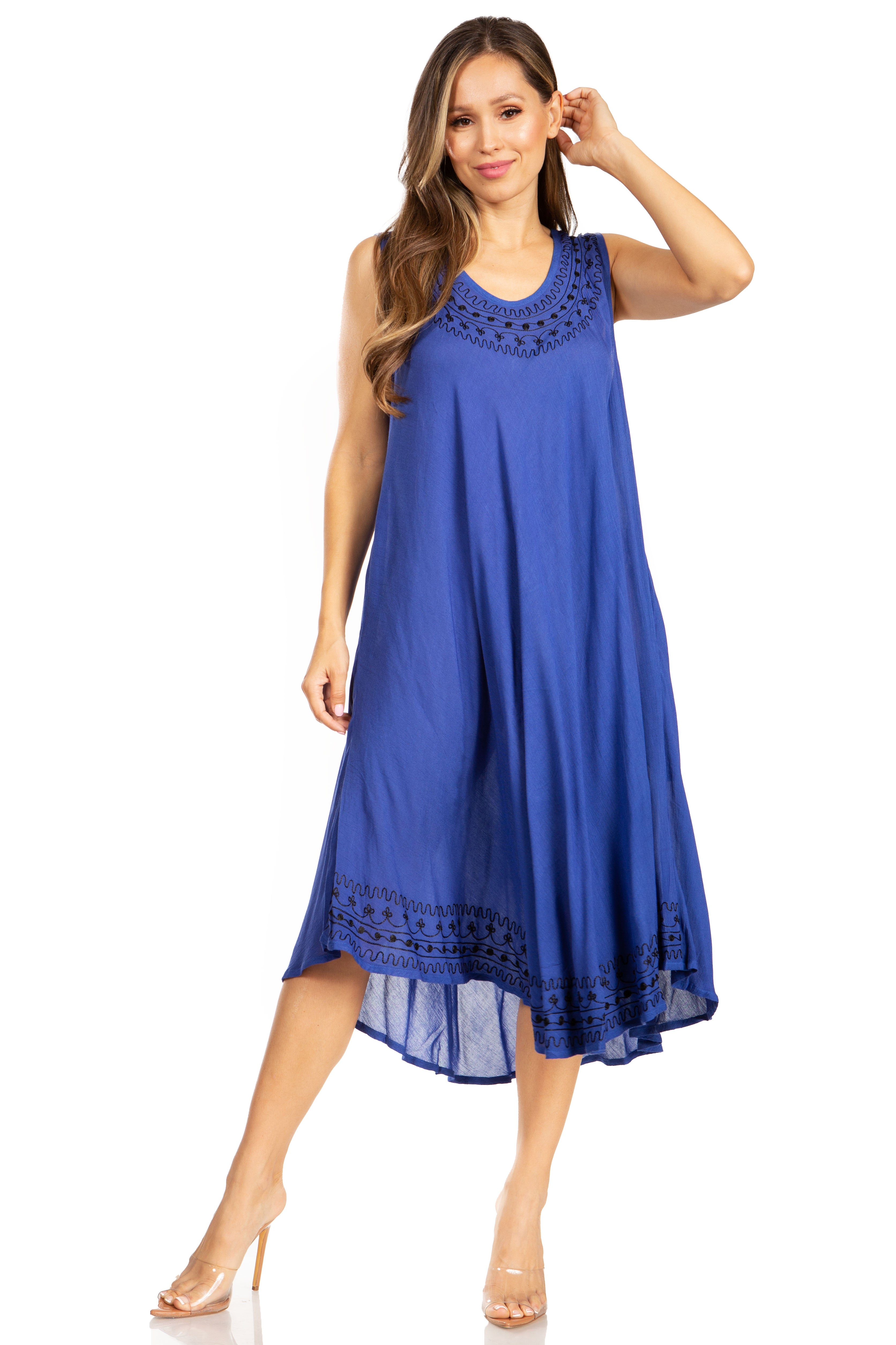 Woman wearing a blue dress with lace details on a white background