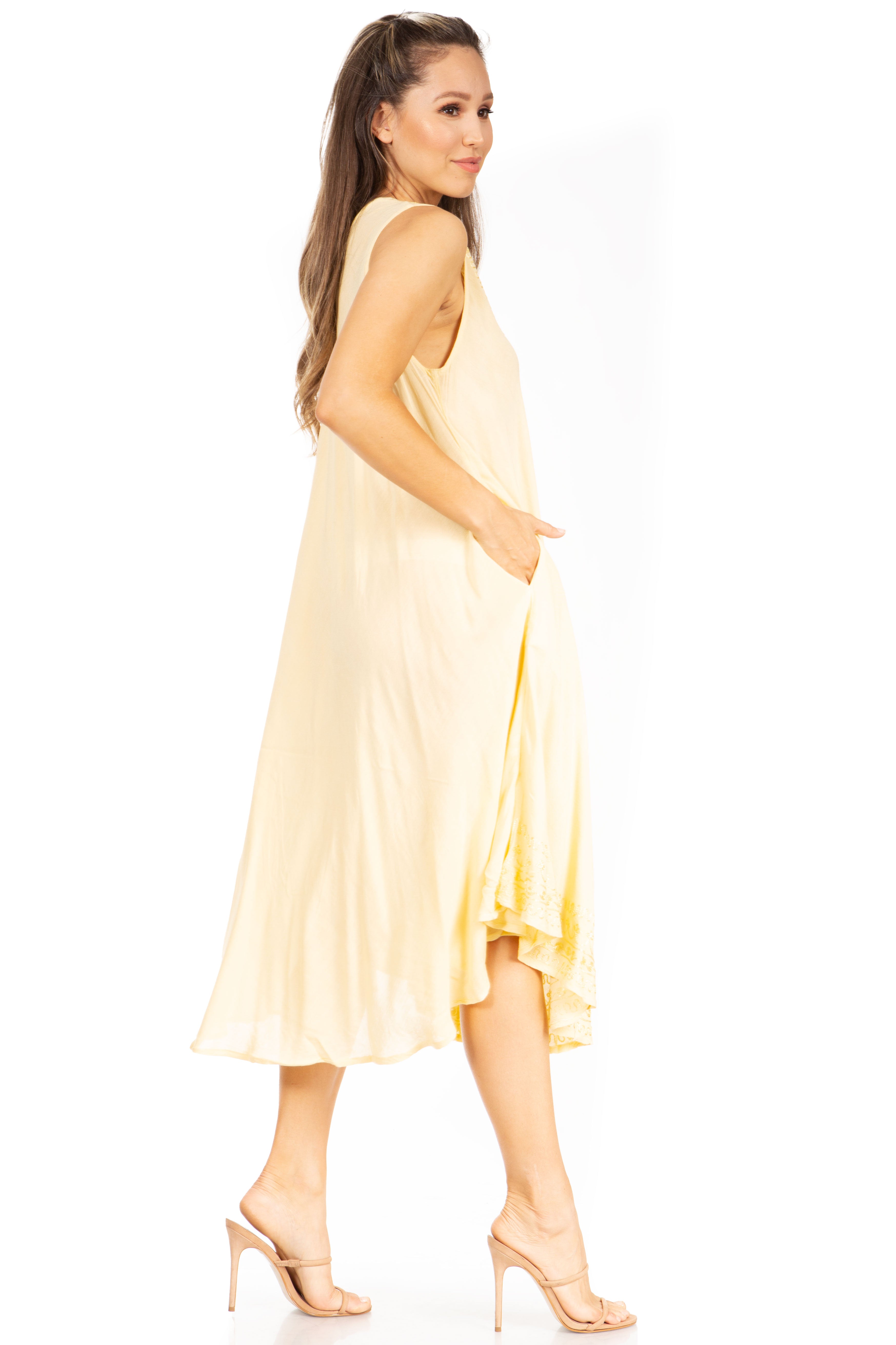 Woman wearing a light yellow dress on a white background