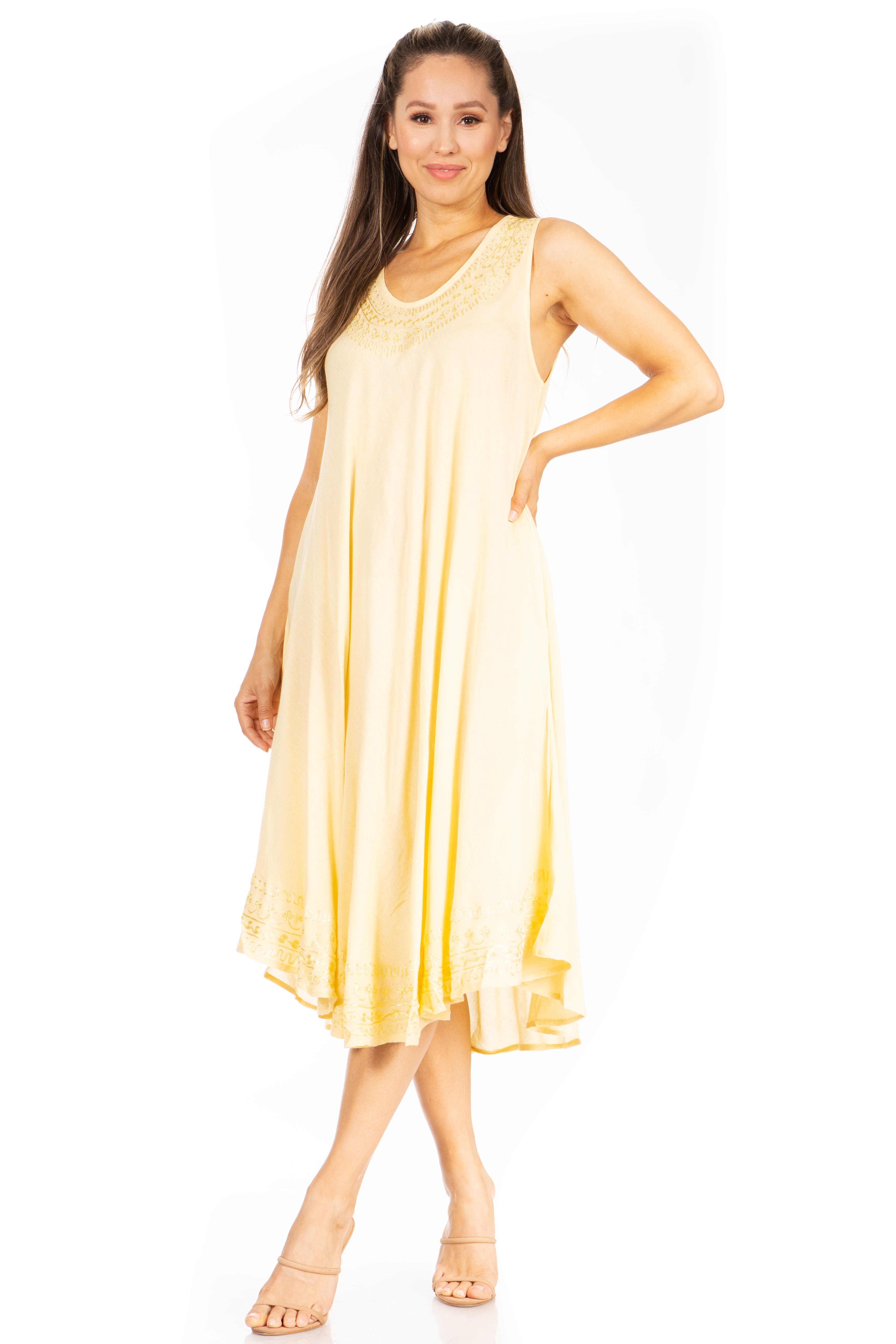 Woman wearing a yellow sleeveless dress on a white background