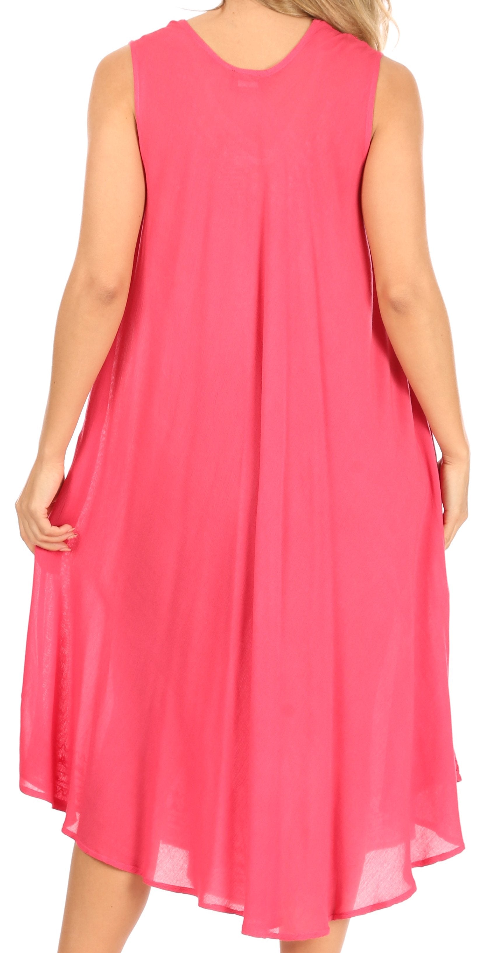 Woman wearing a pink sleeveless dress against a white background