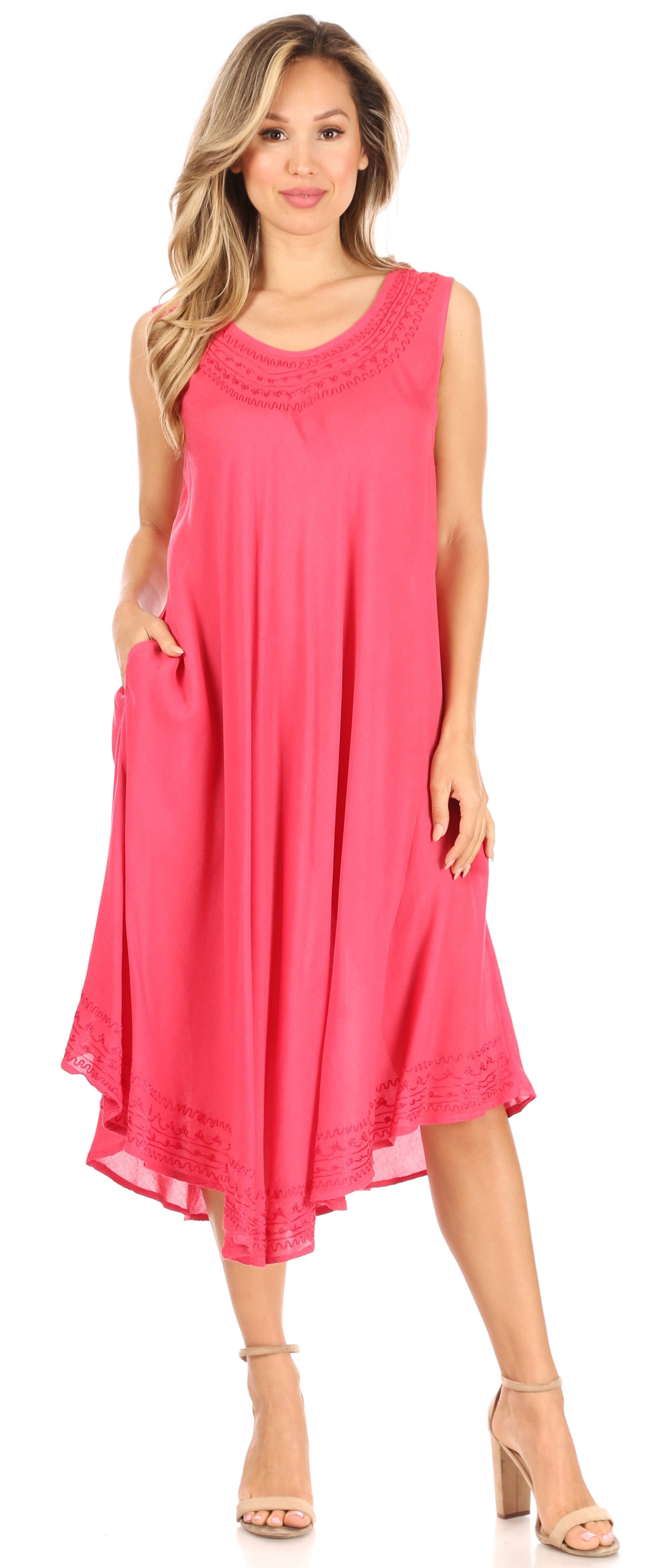Woman wearing a pink sleeveless dress on a white background