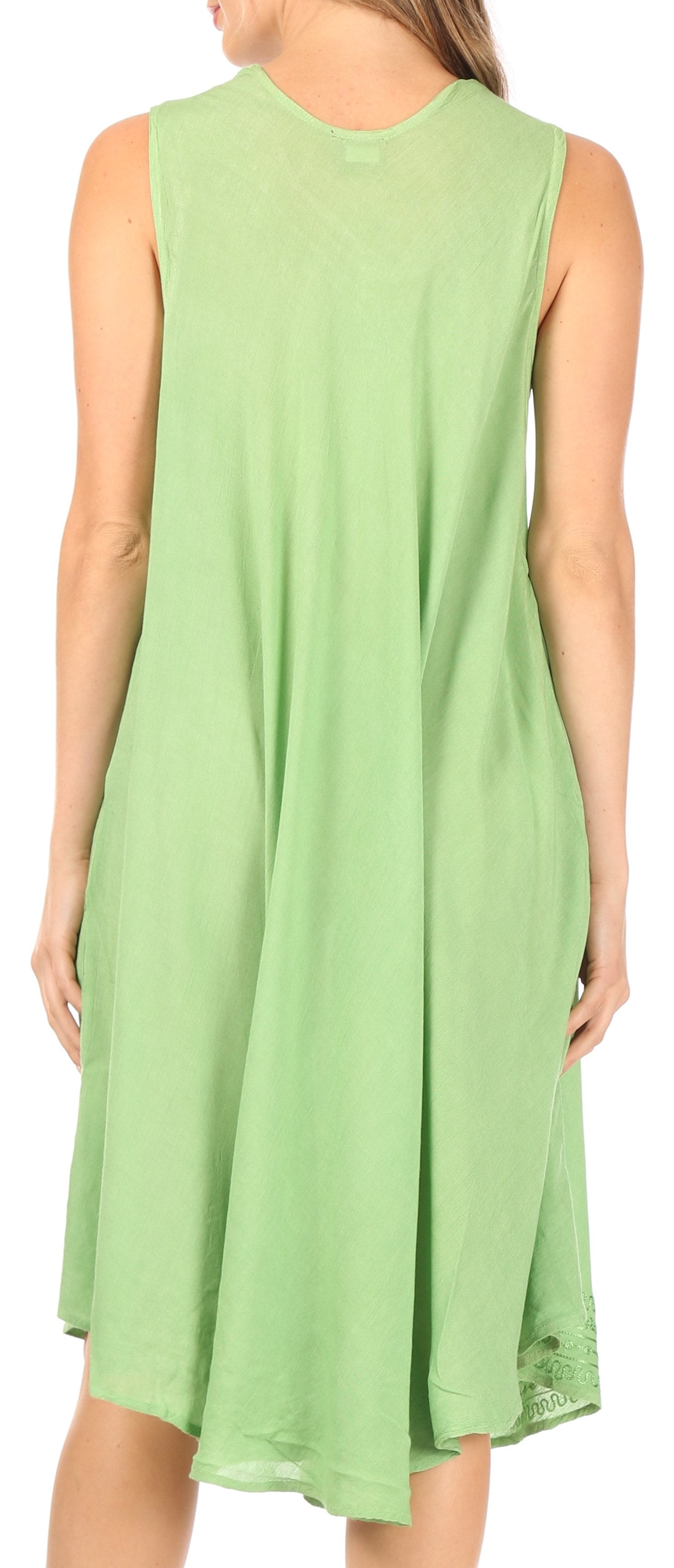 Green sleeveless dress worn by a person on a white background