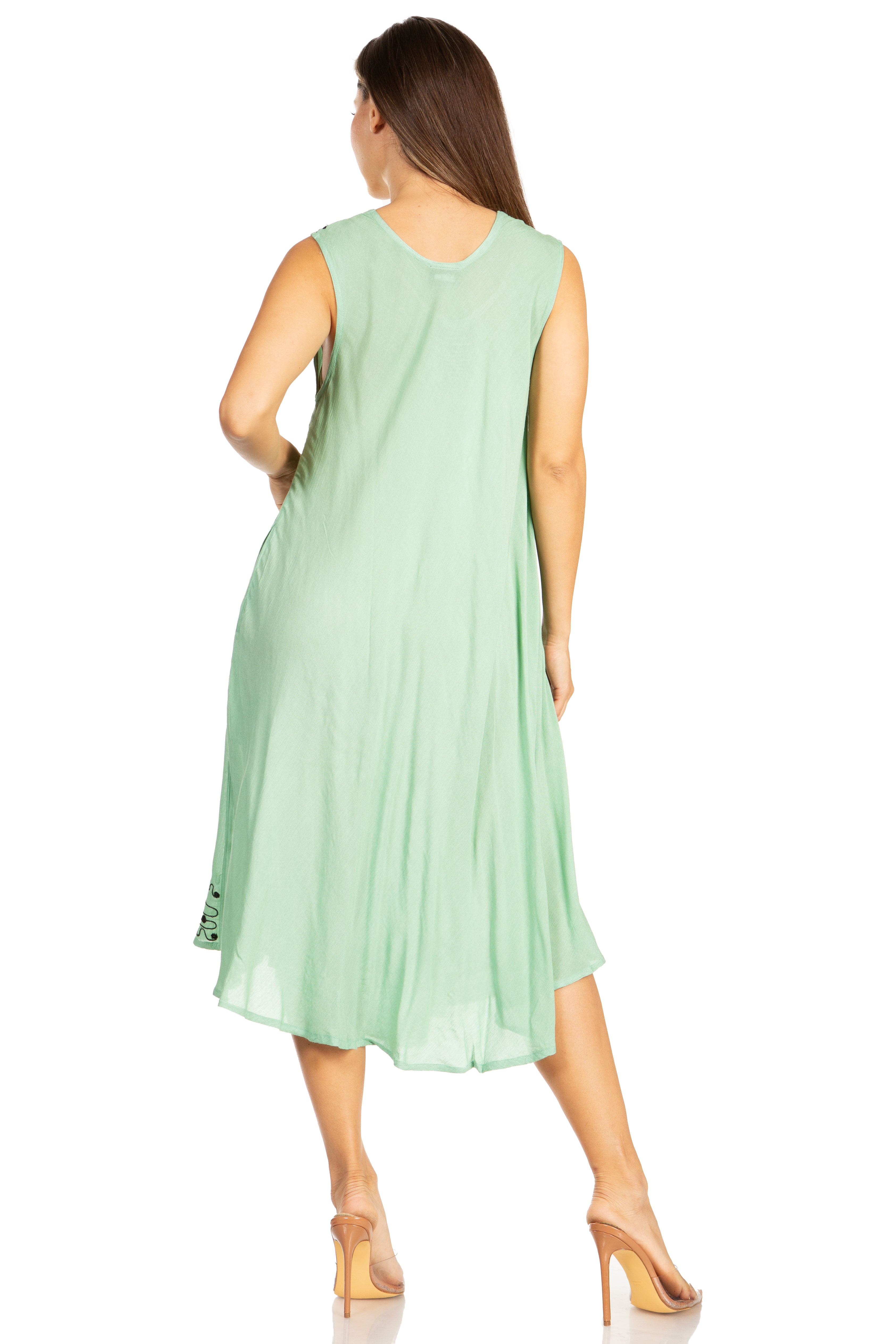 Woman wearing a light green dress on a white background