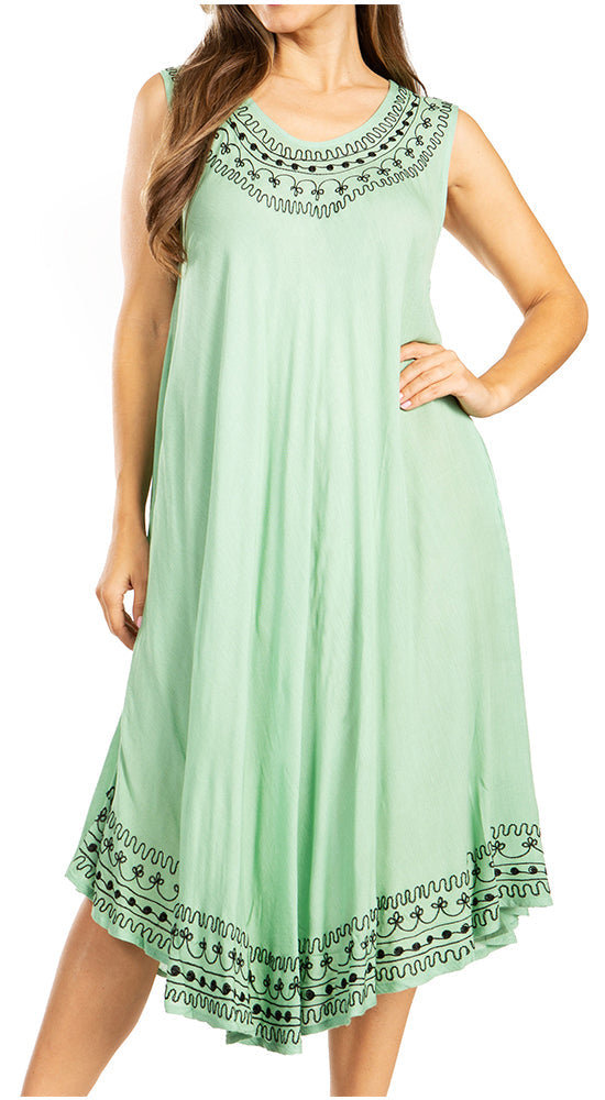 Mint green dress with black embroidery on a white background