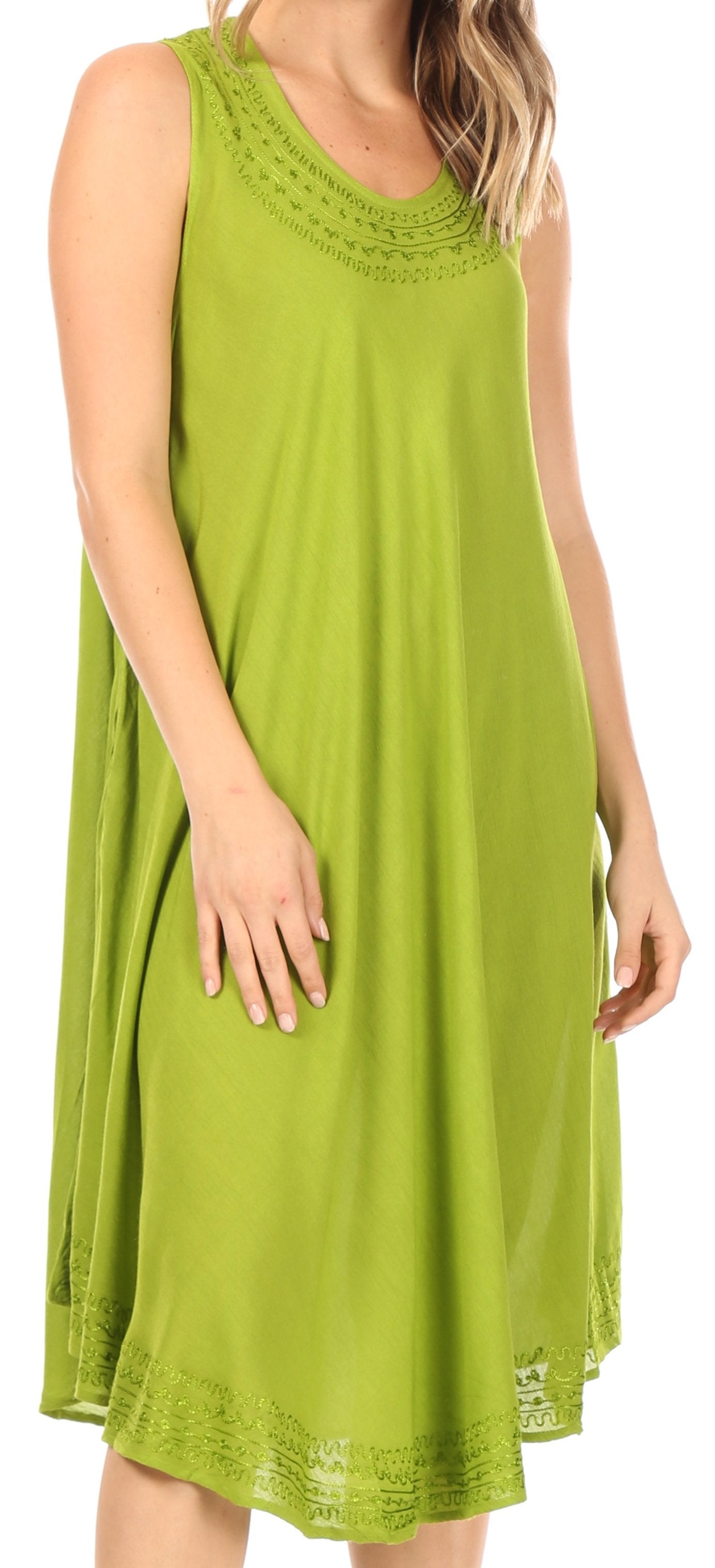 Green sleeveless dress with lace details on a white background
