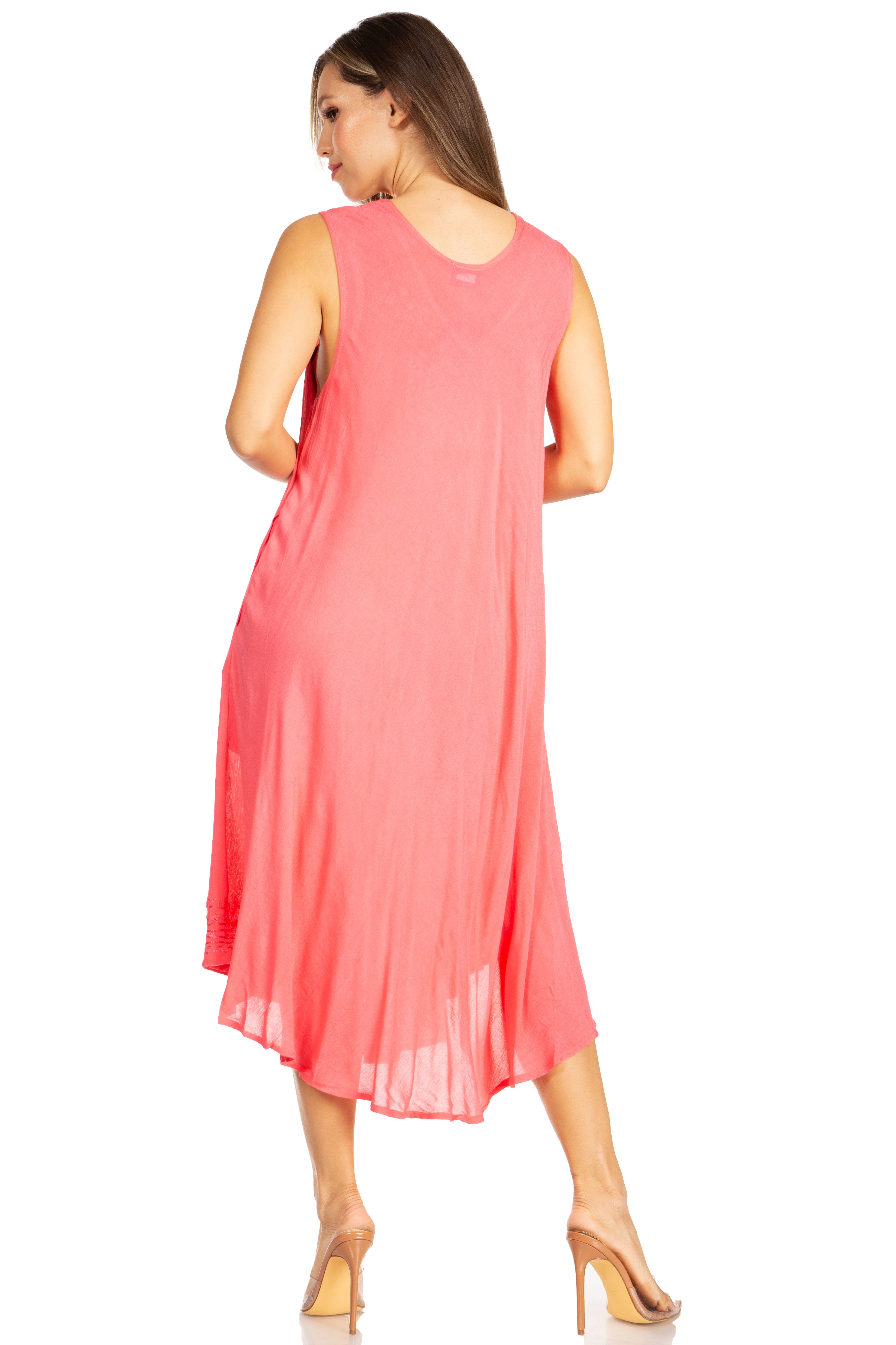 Woman wearing a coral dress on a white background