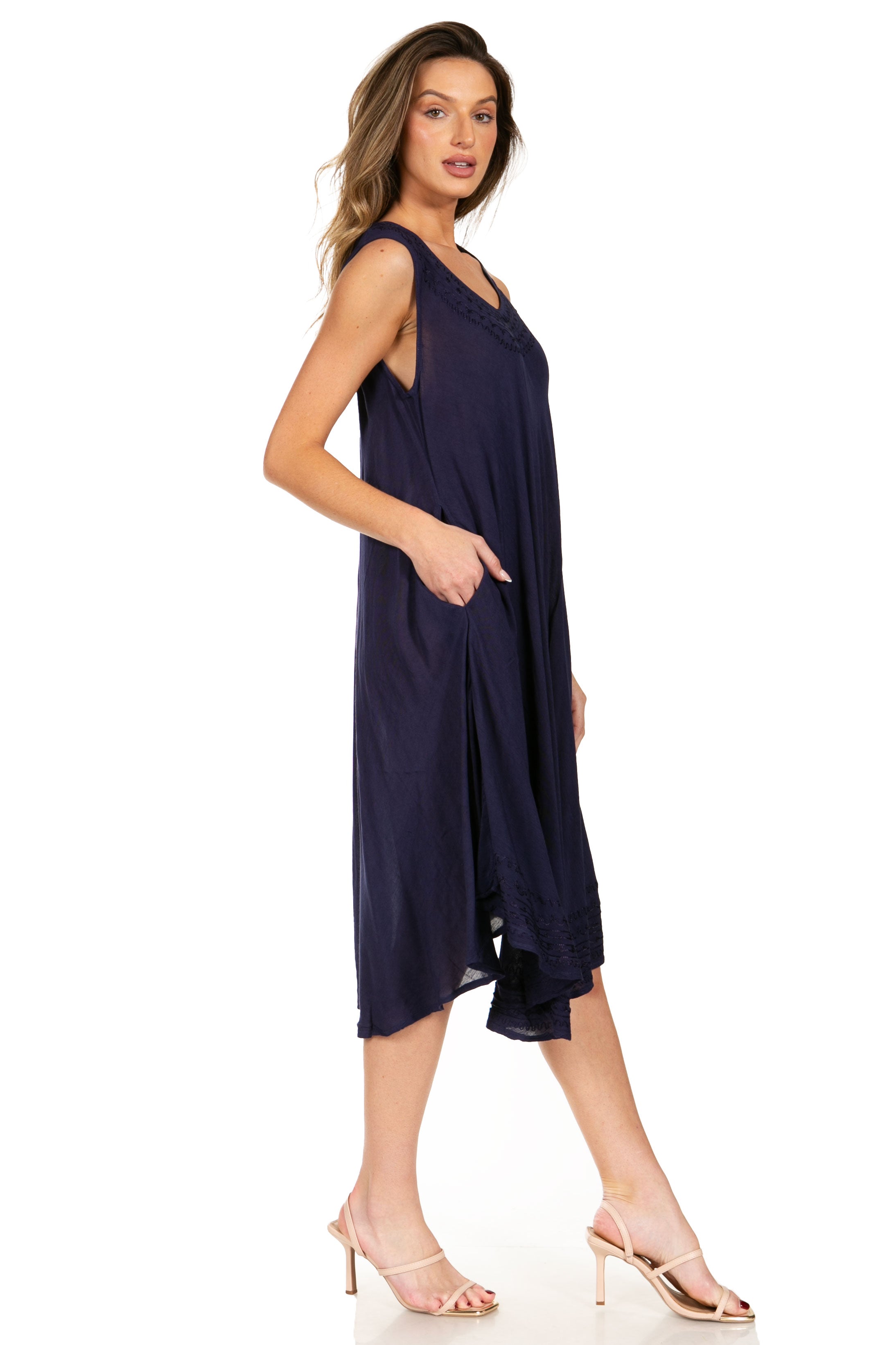 Woman wearing a navy blue dress on a white background