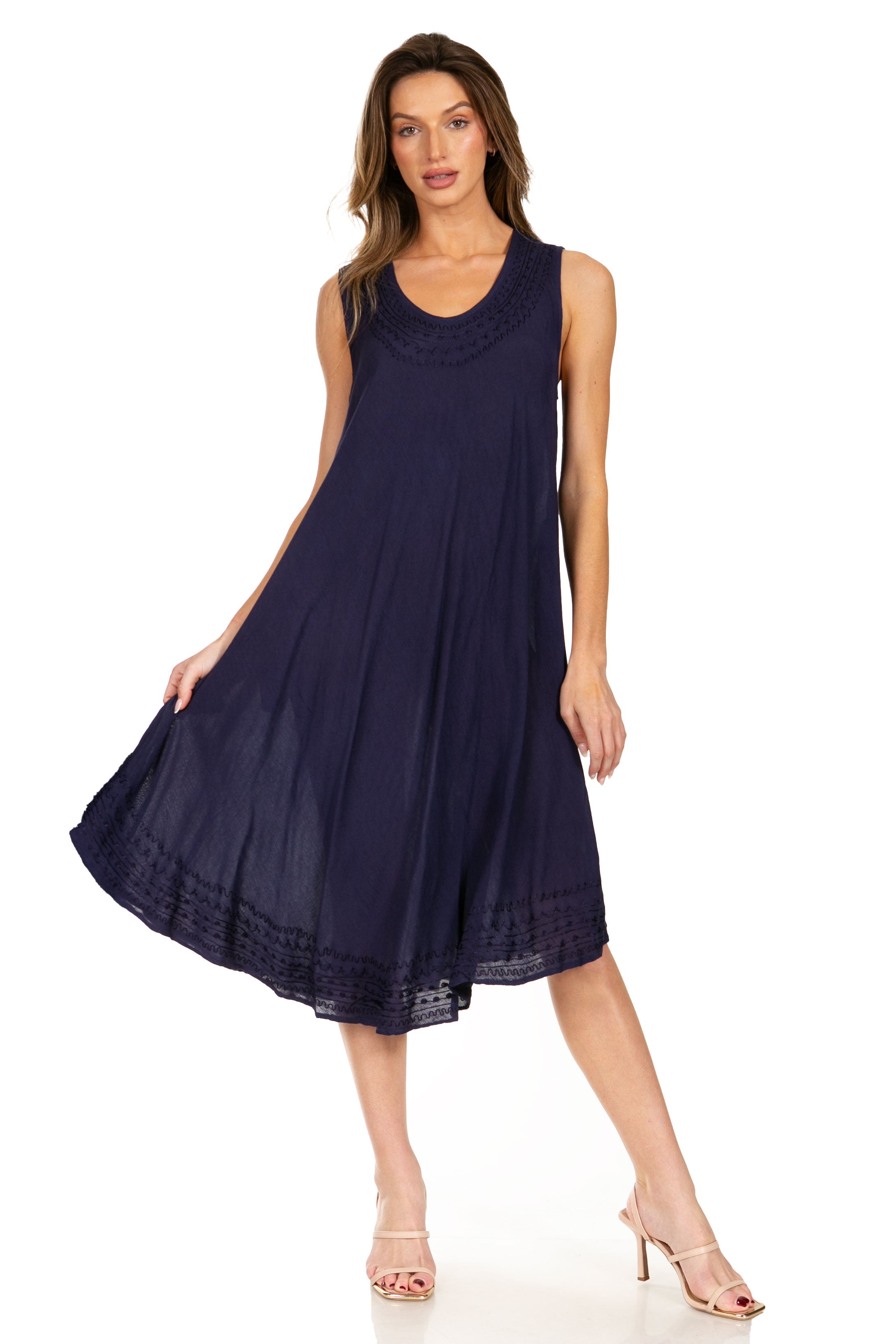 Woman wearing a navy sleeveless dress on a white background