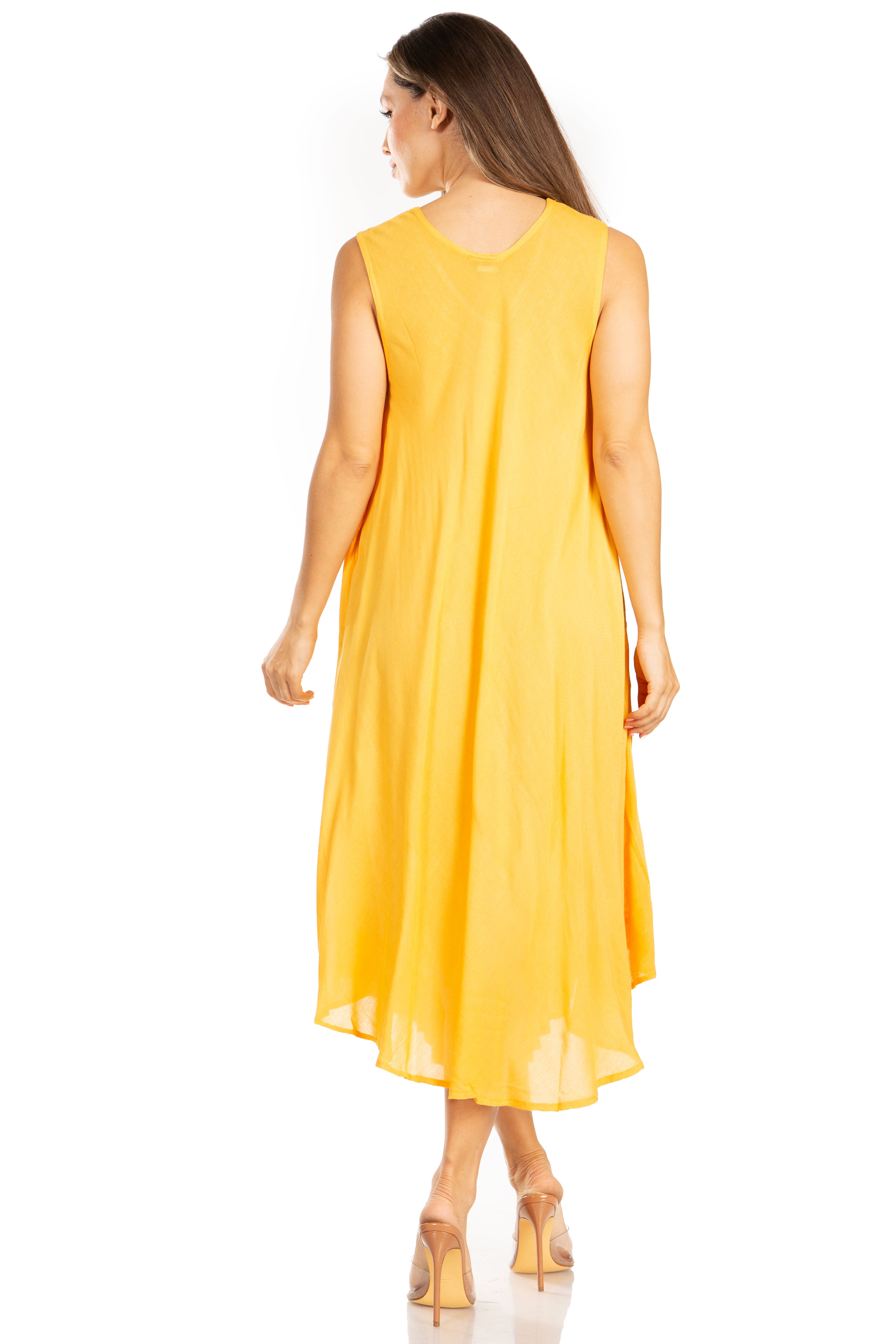 Woman wearing a yellow sleeveless dress on a white background