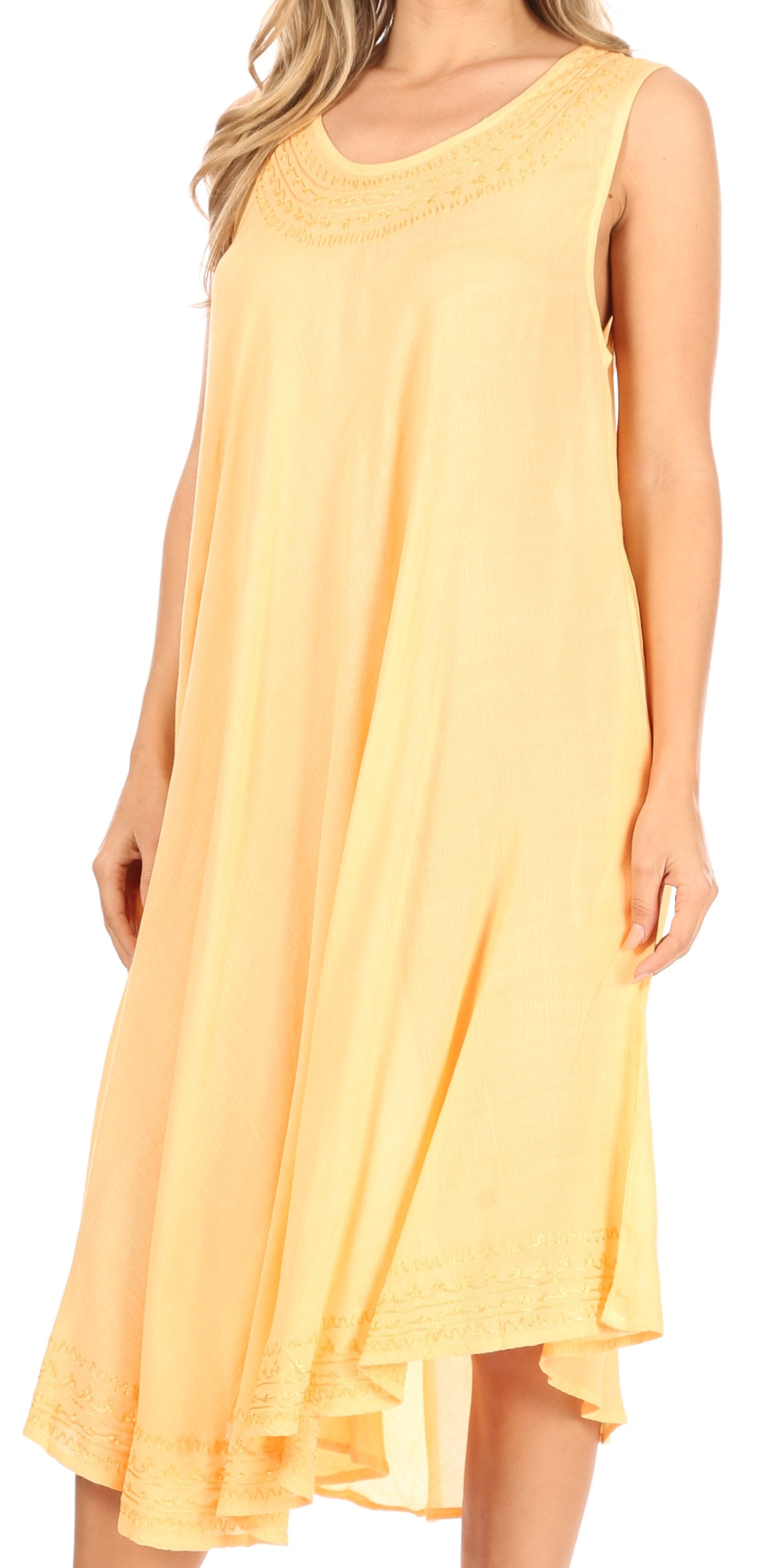 Yellow sleeveless dress worn by a model on a white background