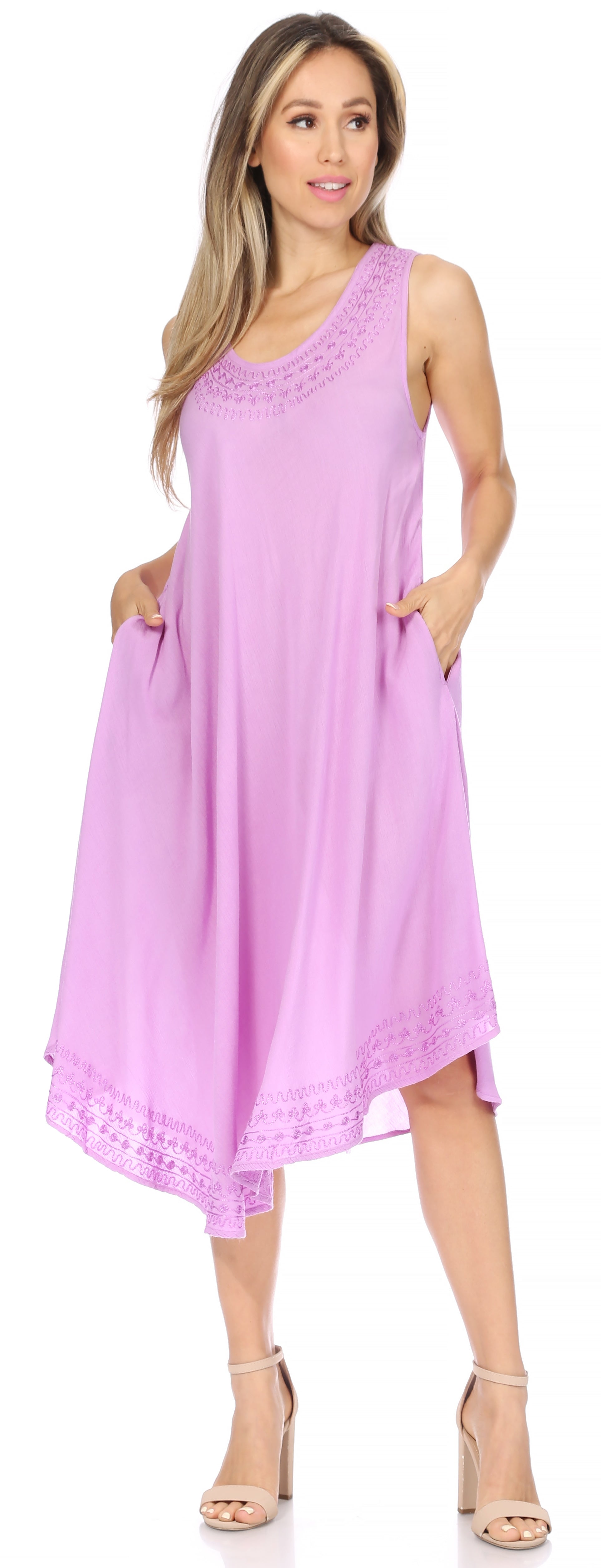 Woman wearing a purple sleeveless dress with lace details on a white background