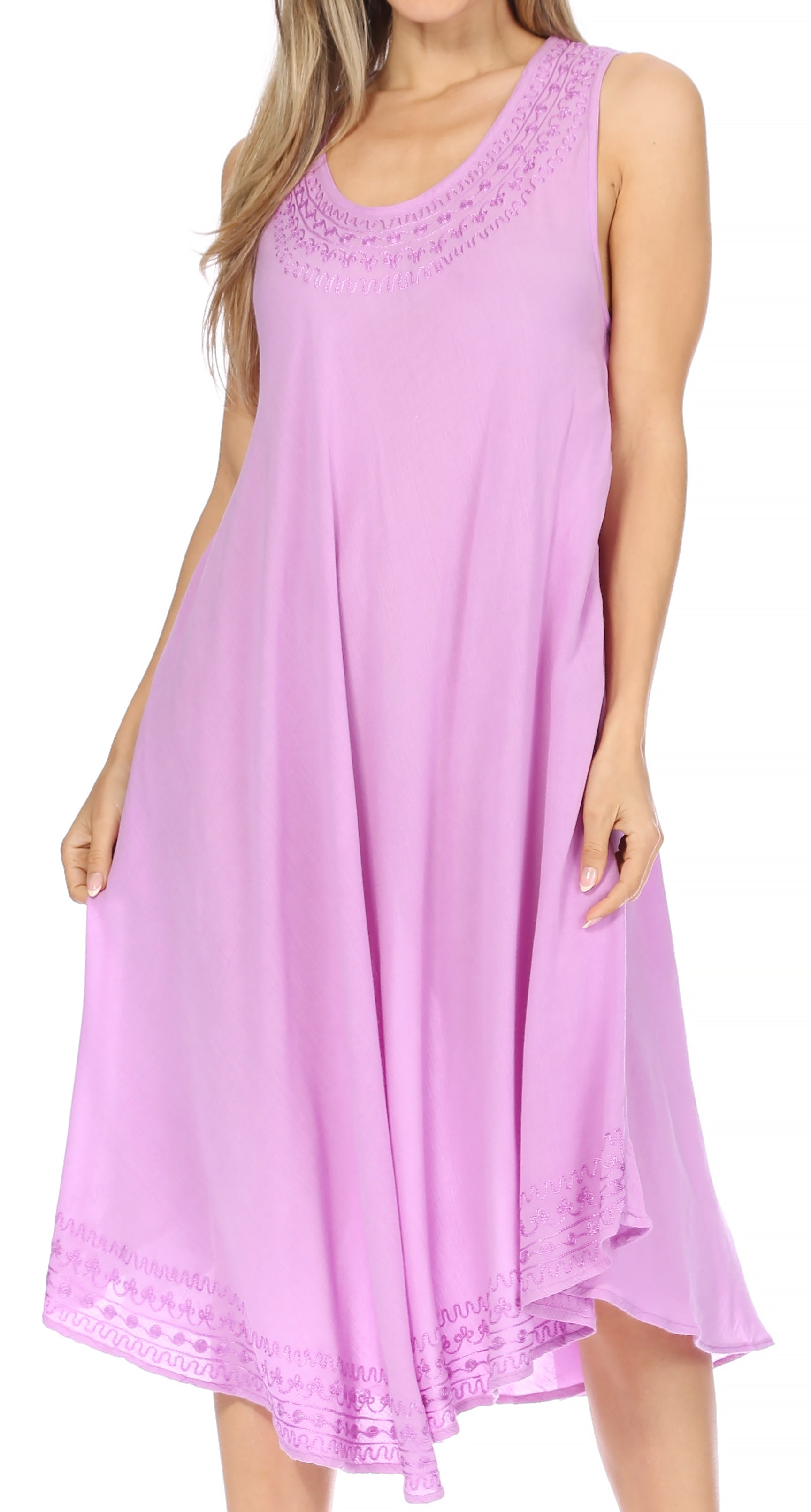 Woman wearing a sleeveless purple dress with lace details on a white background