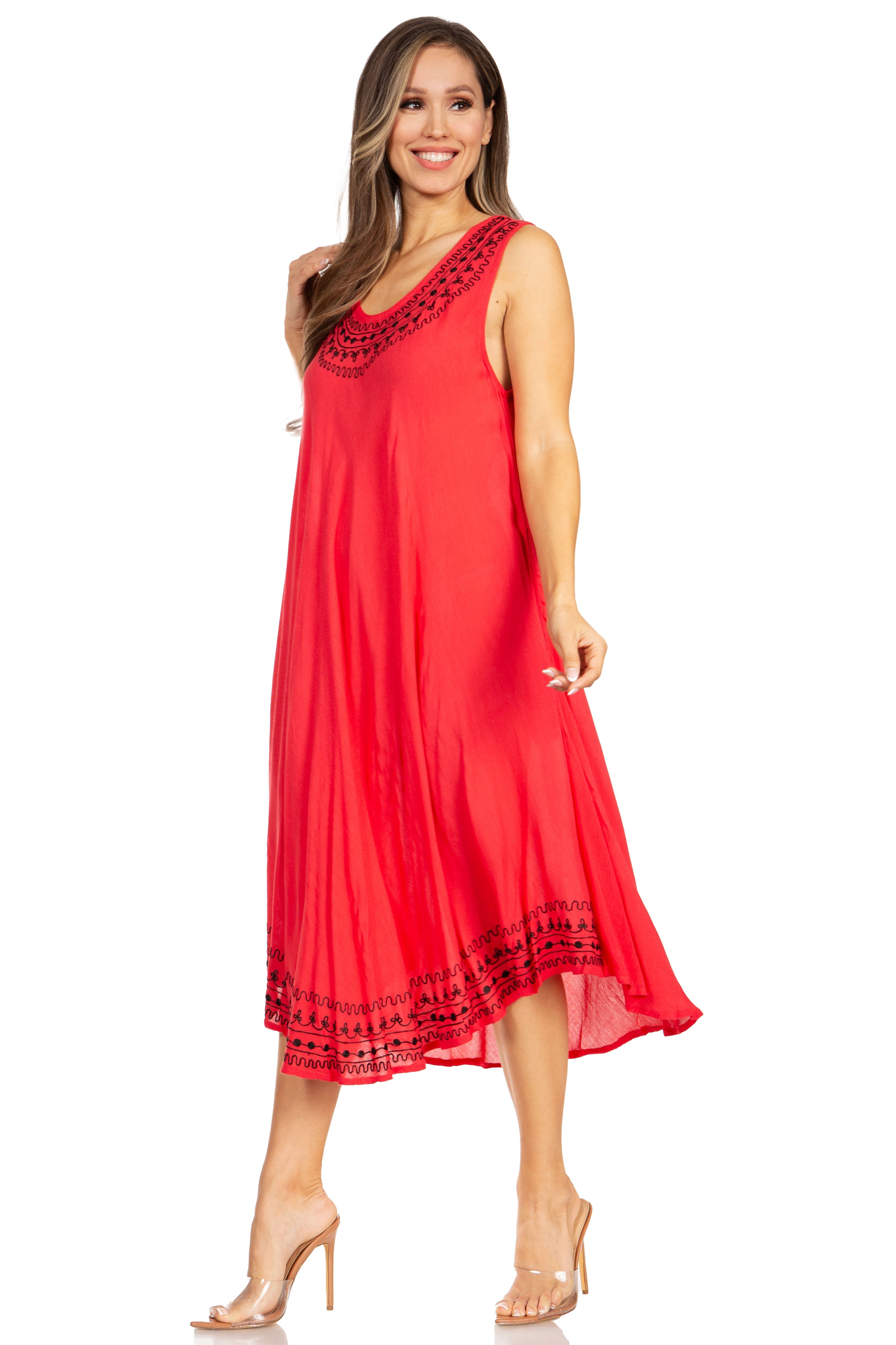 Woman wearing a red dress with black embroidery on a white background