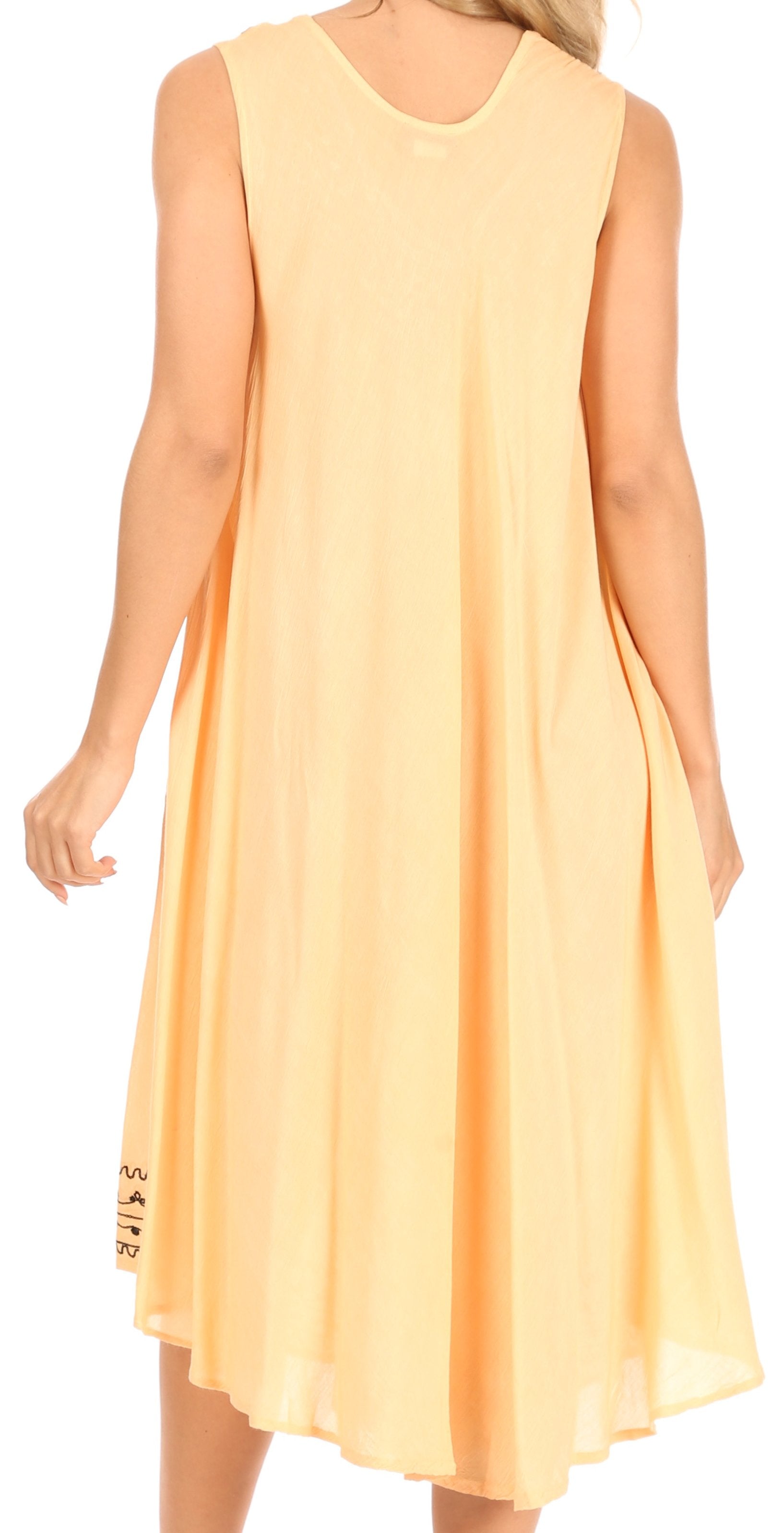 Woman wearing a yellow sleeveless dress on a white background