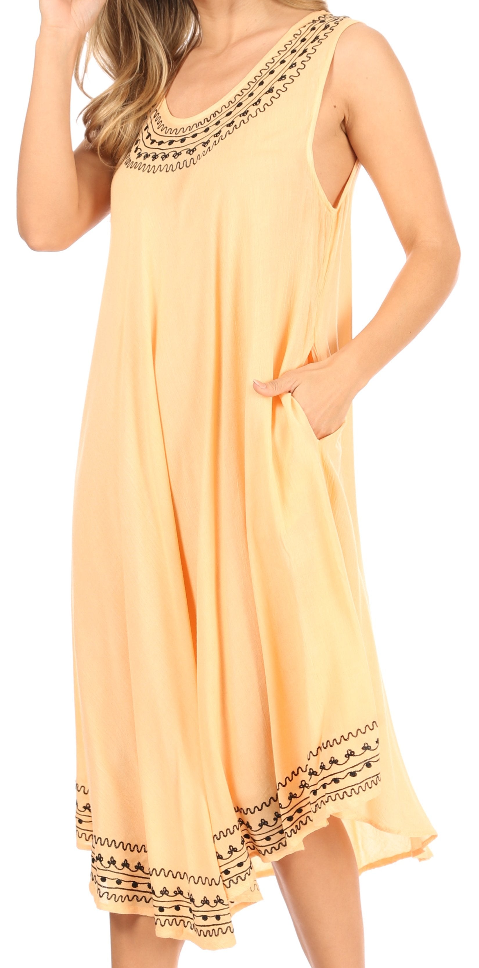 Yellow dress with intricate embroidery on a white background