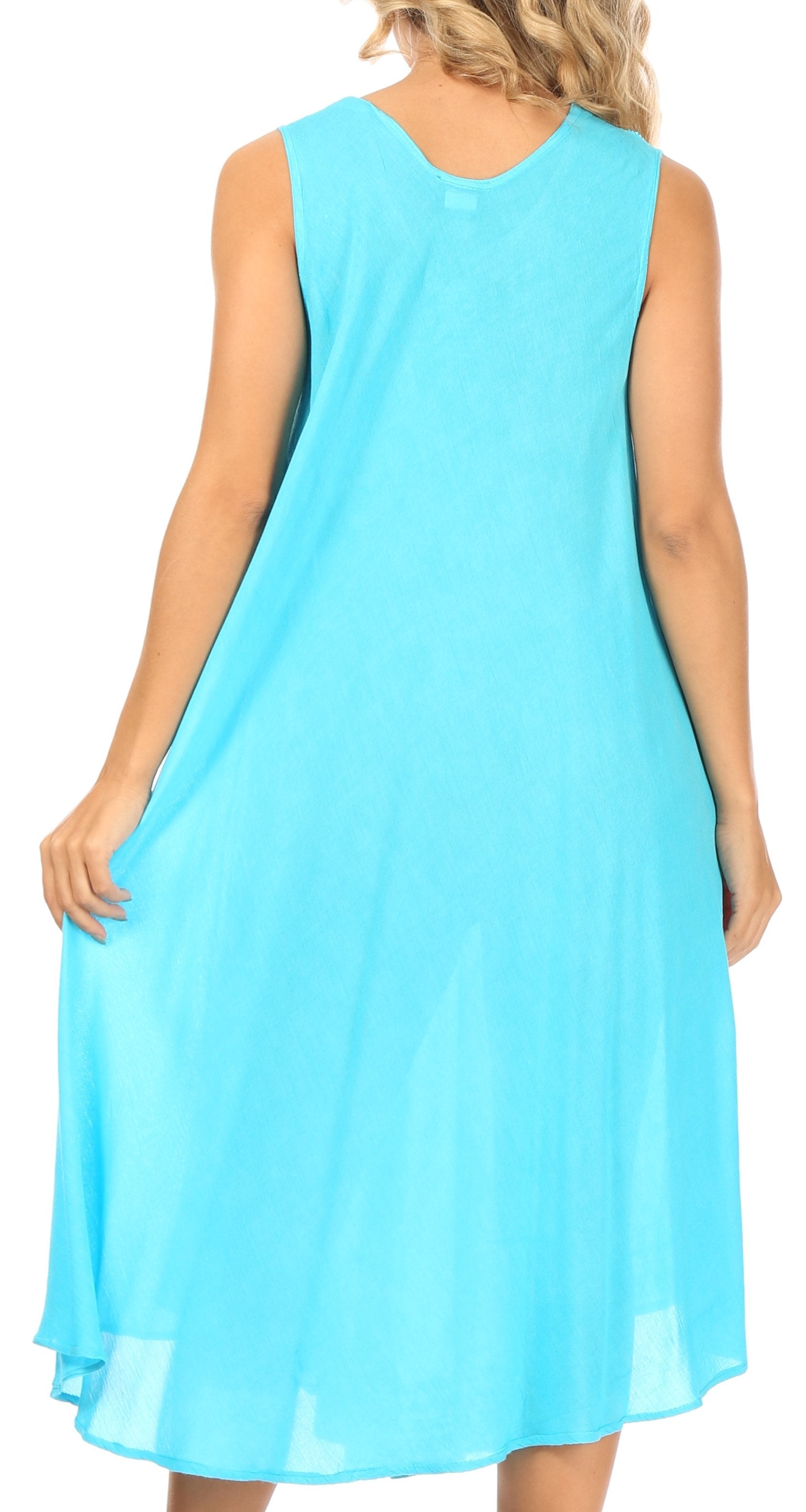 Woman wearing a light blue sleeveless dress on a white background