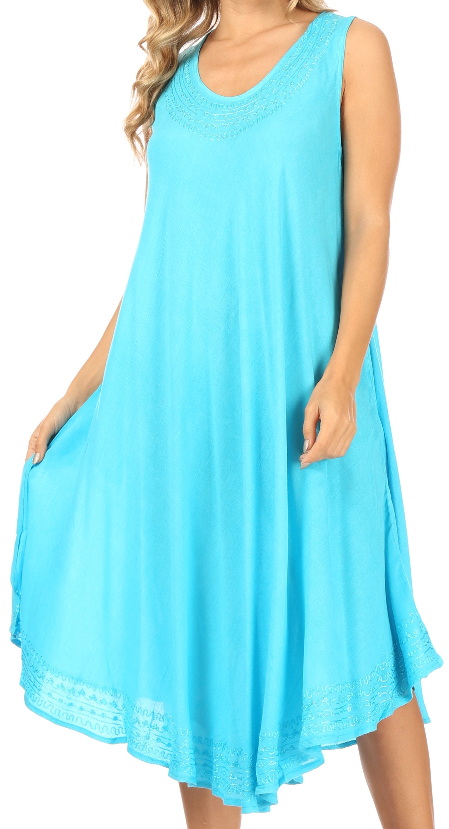 Woman wearing a light blue sleeveless dress on a white background