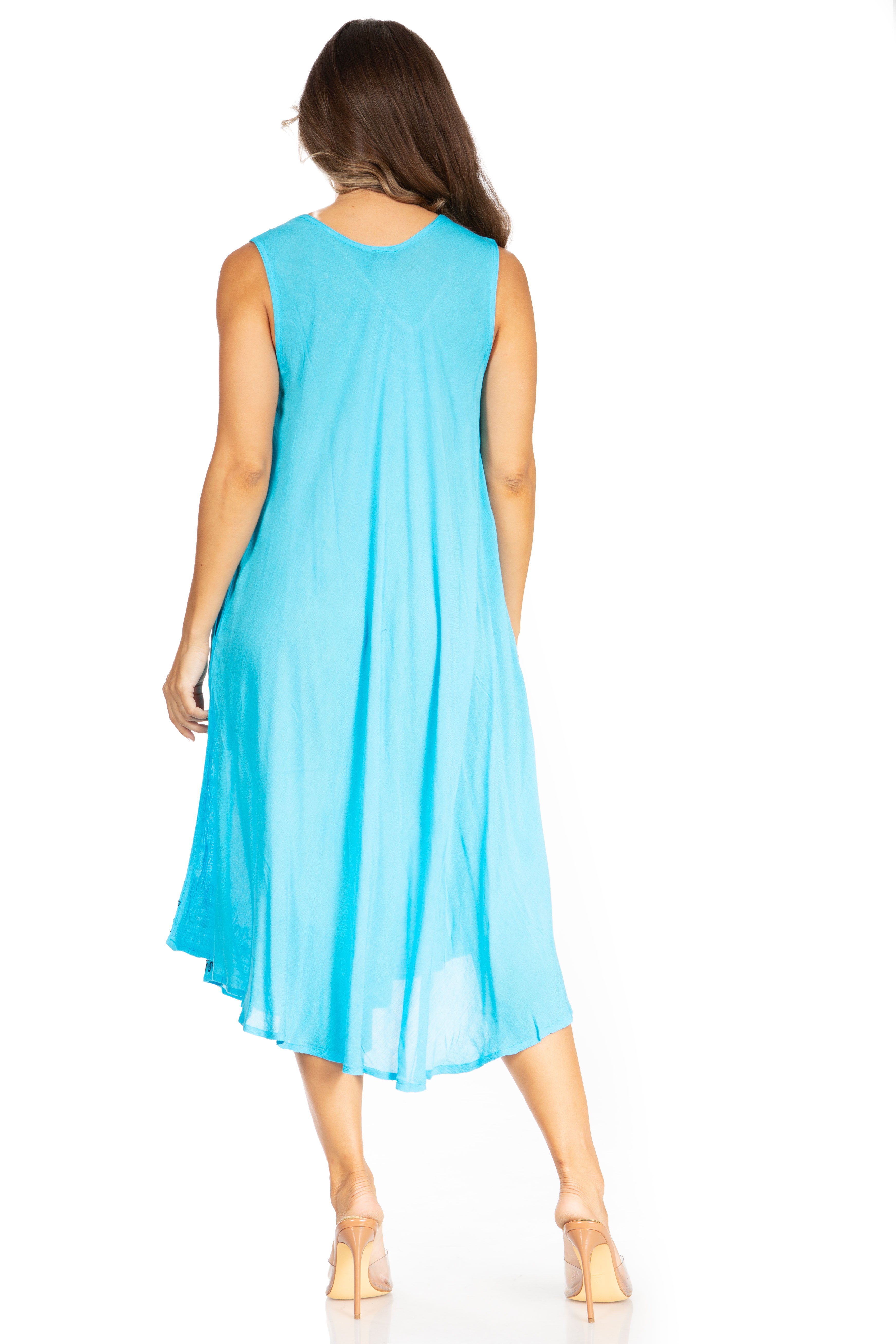 Woman wearing a light blue sleeveless dress on a white background