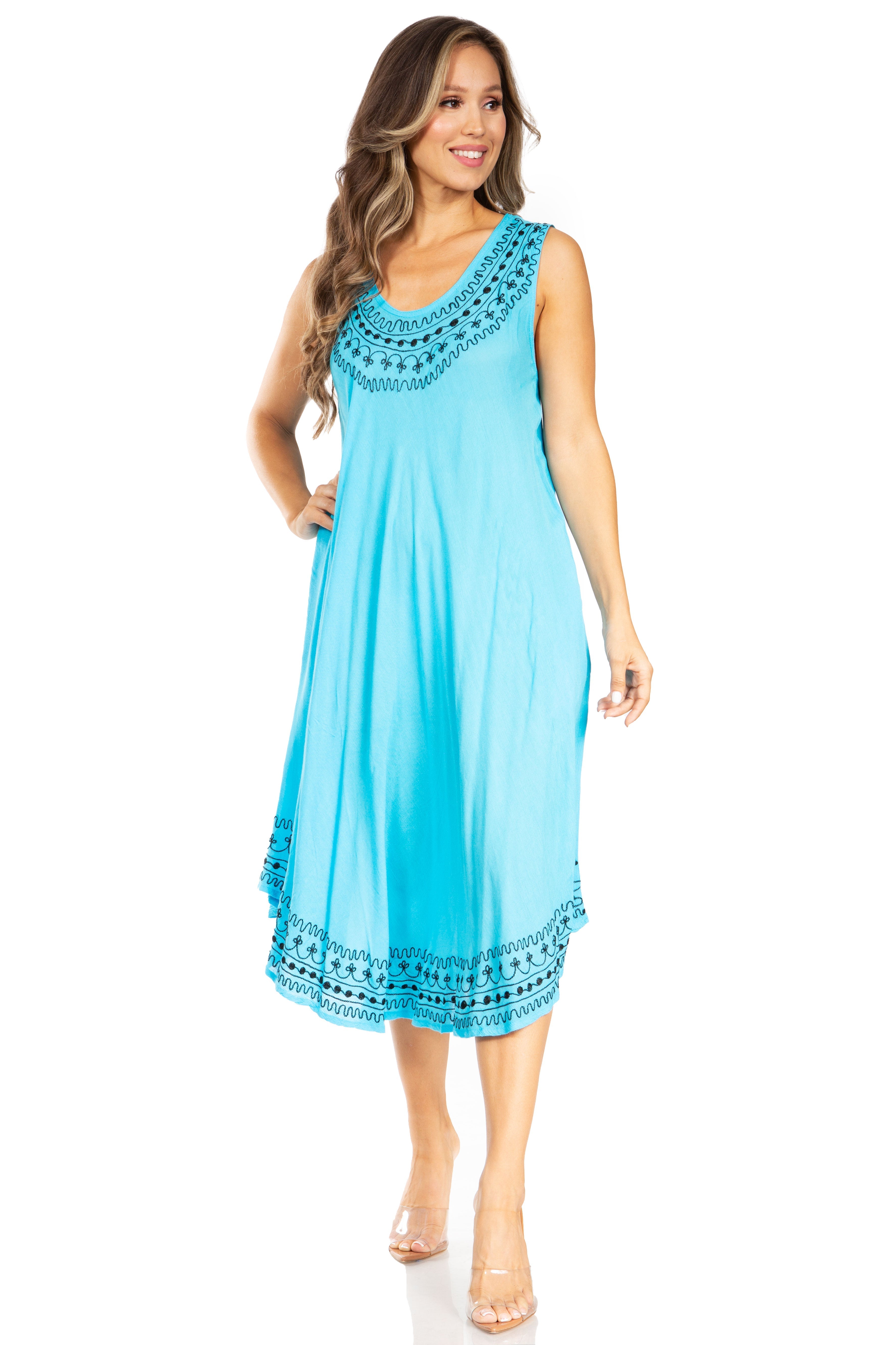 Woman wearing a blue dress with lace details on a white background