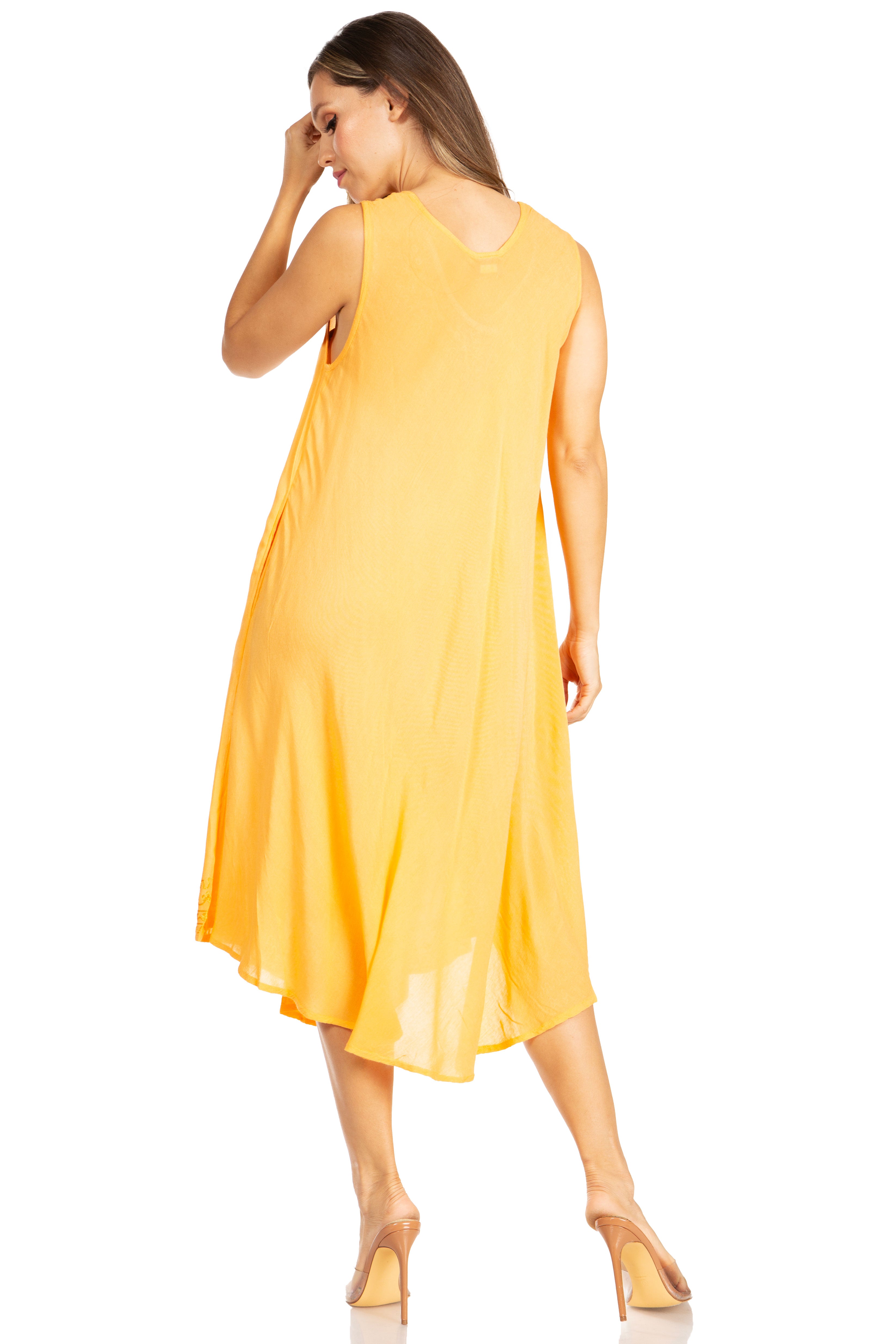 Woman wearing a yellow dress on a white background