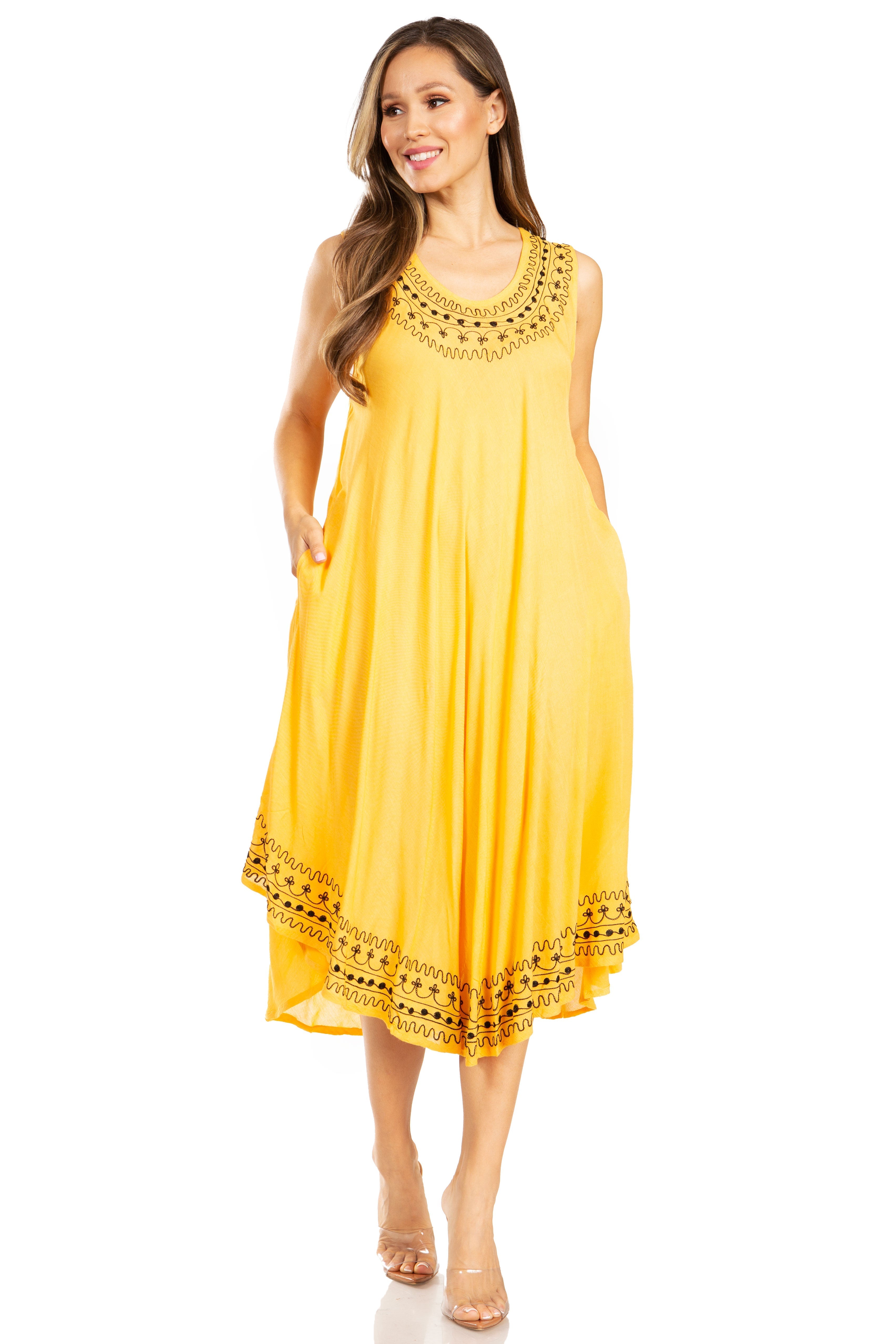 Woman wearing a yellow dress with lace details on a white background