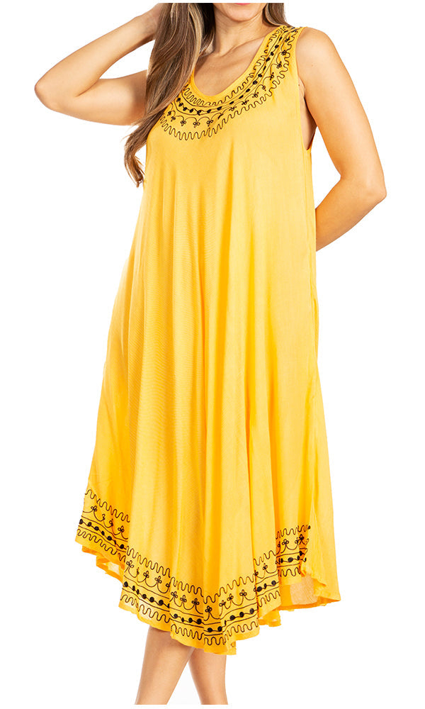 Yellow dress with black lace details on a white background