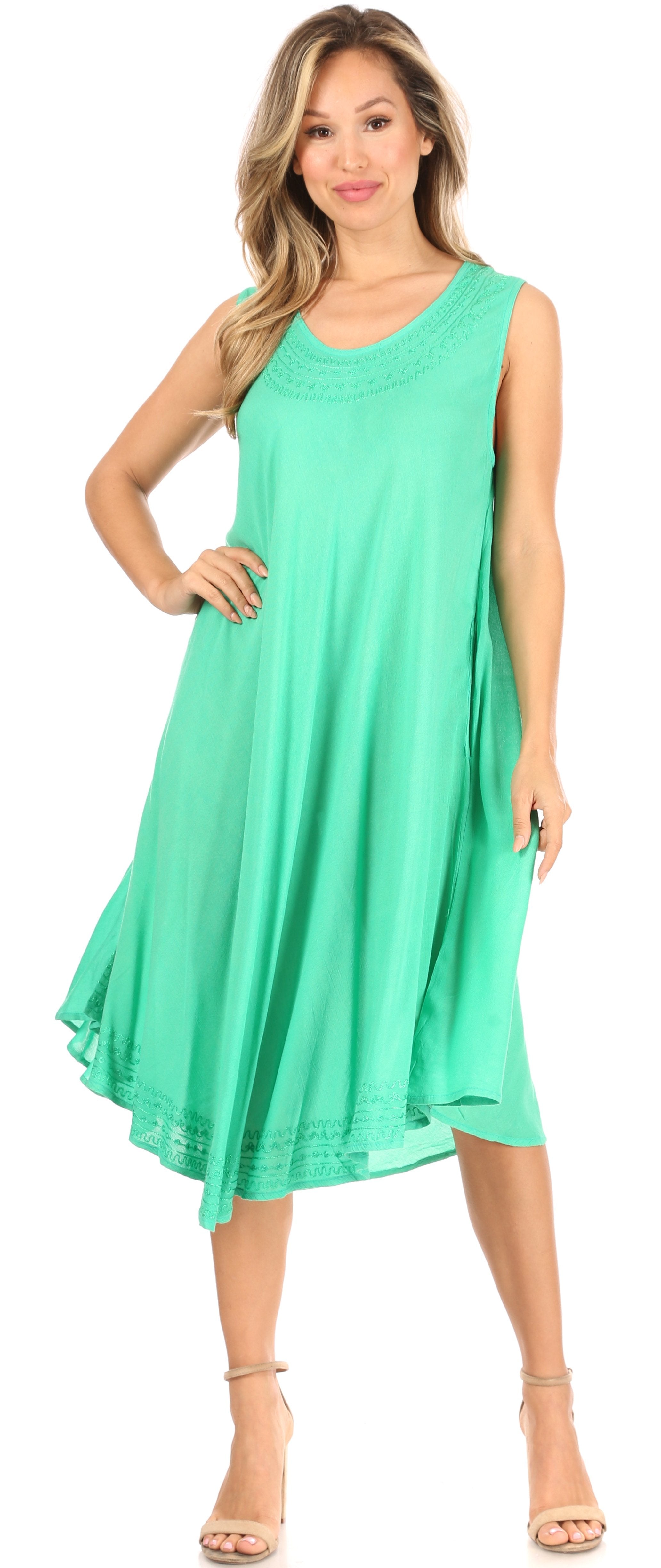 Woman wearing a green dress on a white background