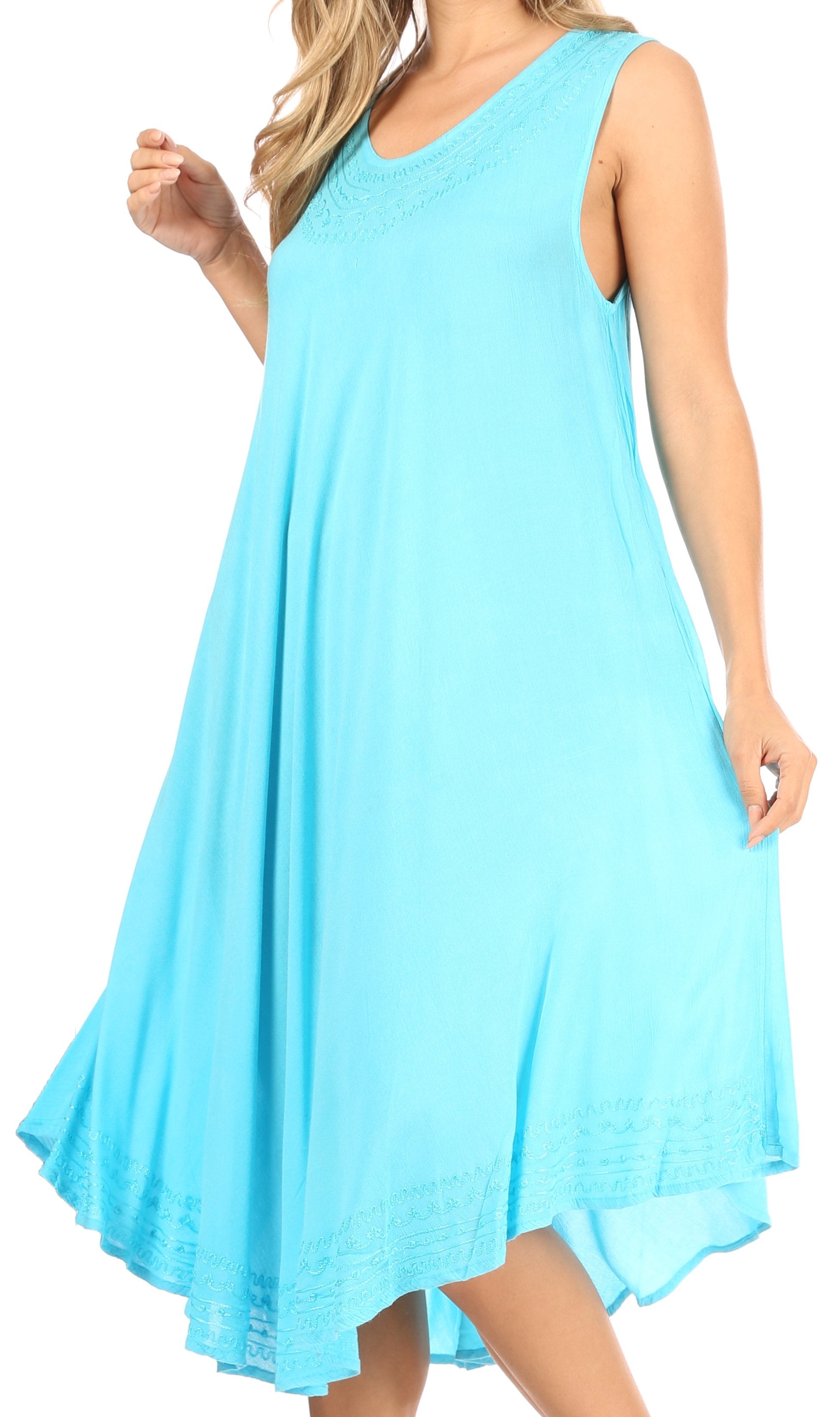 Woman wearing a light blue sleeveless dress on a white background