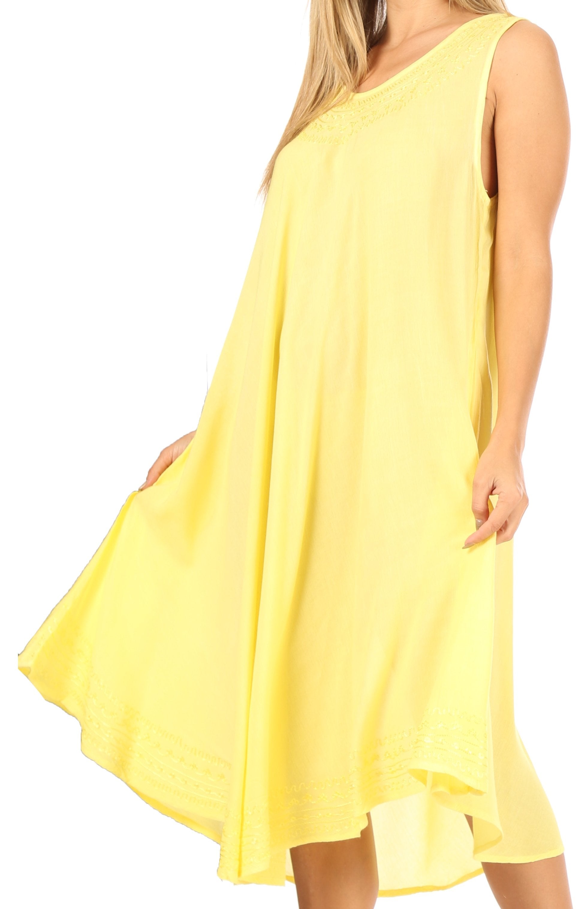 Yellow sleeveless dress worn by a person on a white background