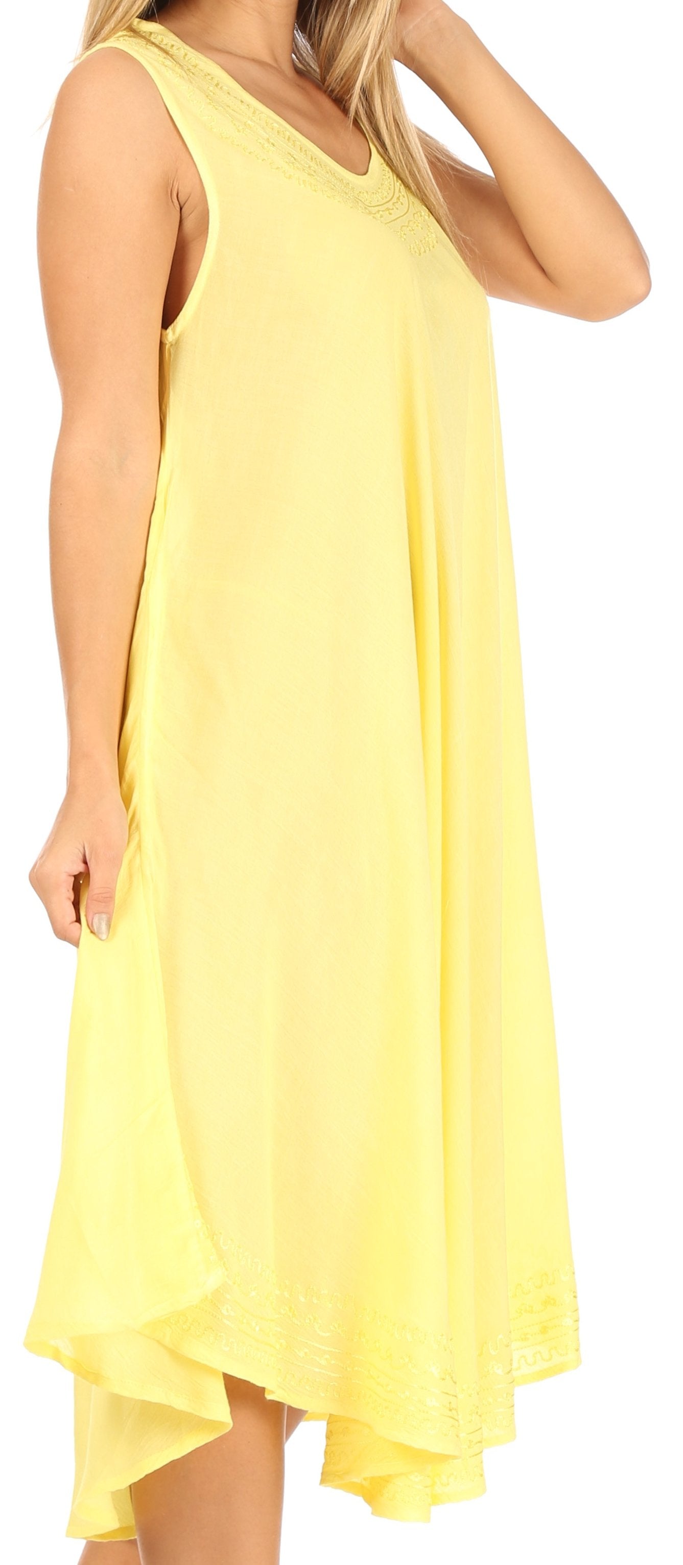 Yellow dress worn by a person, with a focus on the garment.