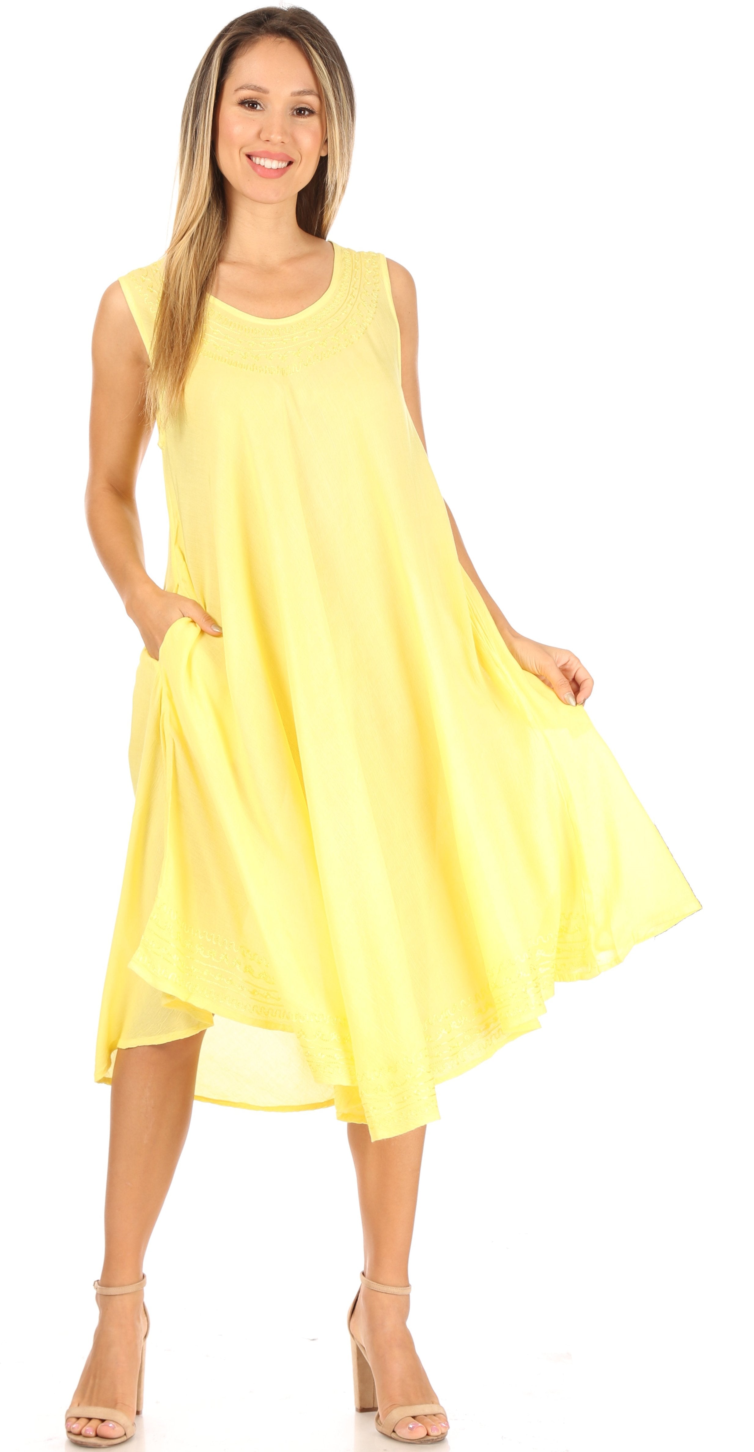 Woman wearing a yellow dress on a white background