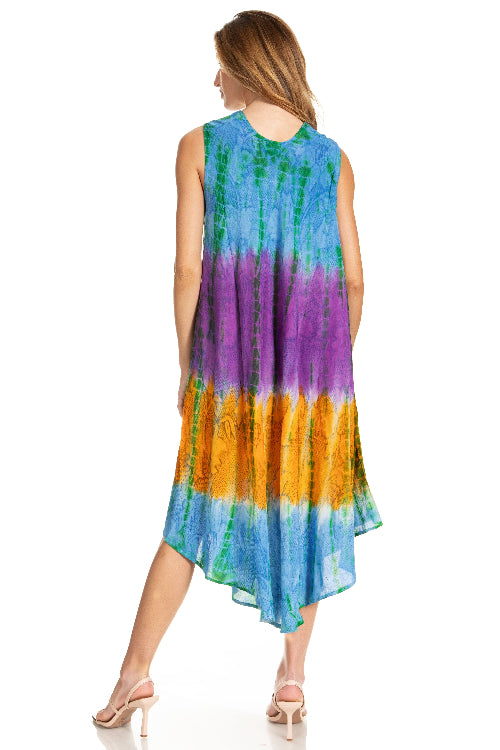 Woman wearing a tie-dye dress with a gradient of blue, green, purple, and orange on a white background.