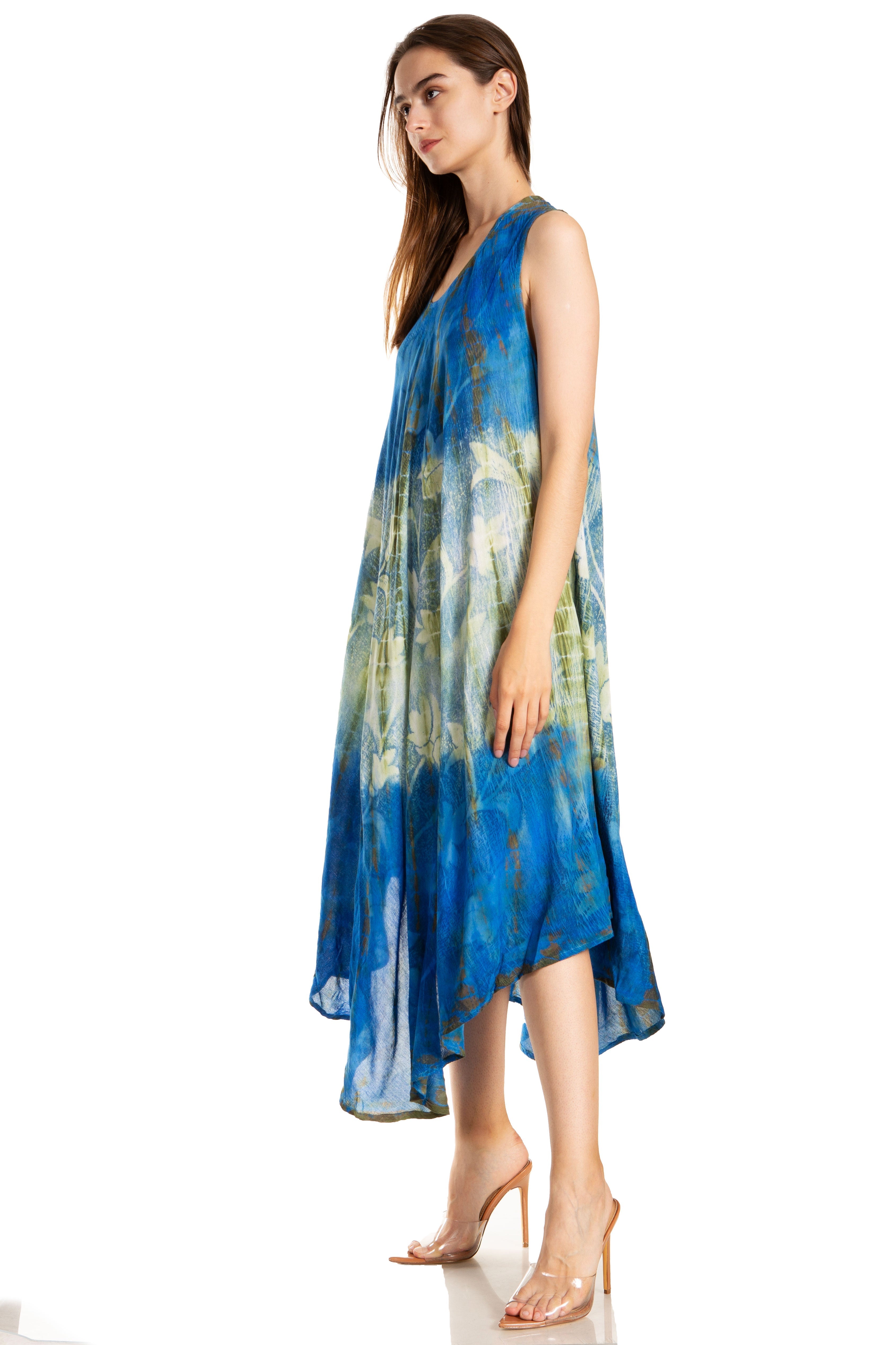 Woman wearing a blue and green patterned dress on a white background