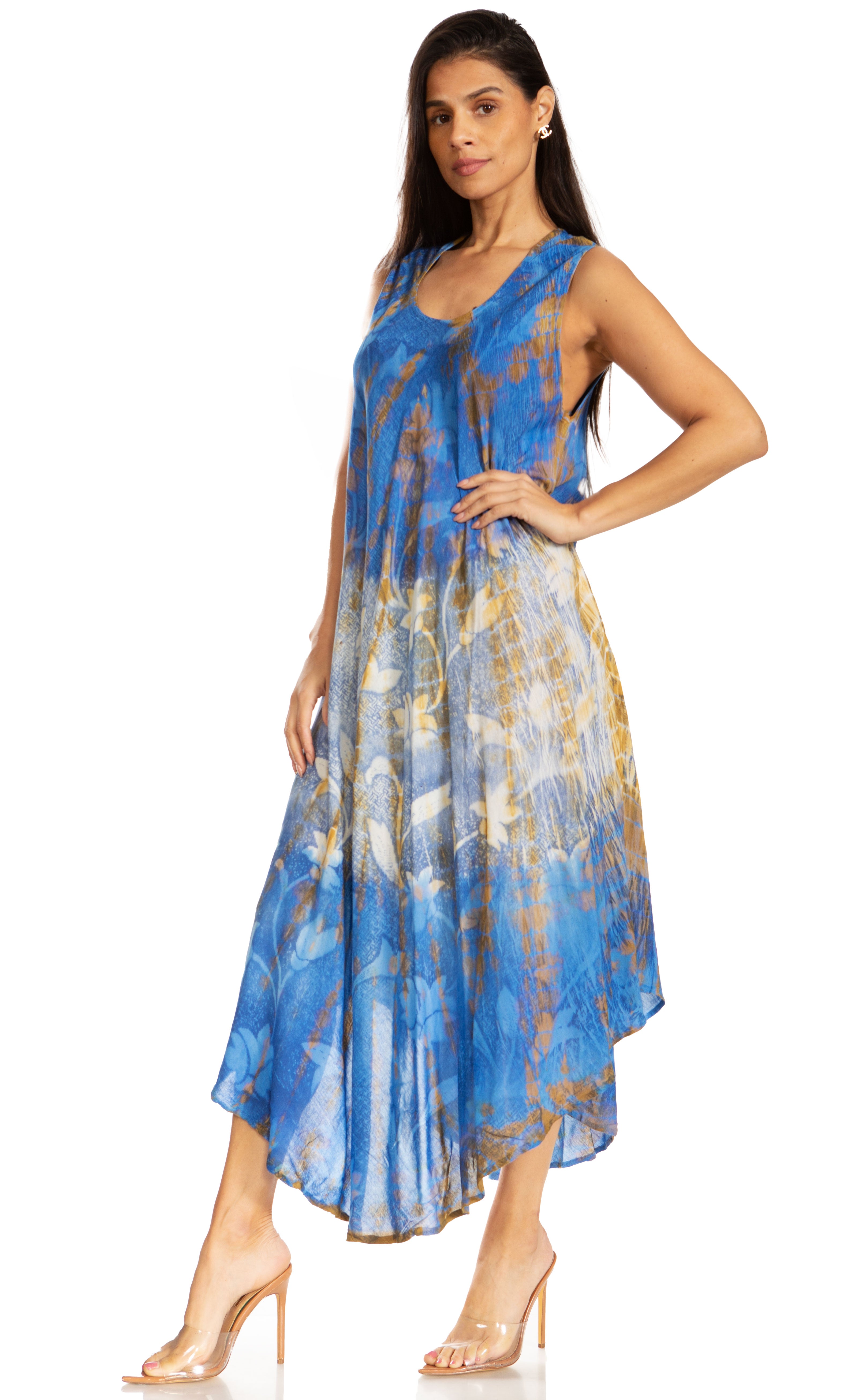 Woman wearing a blue and gold patterned dress on a white background