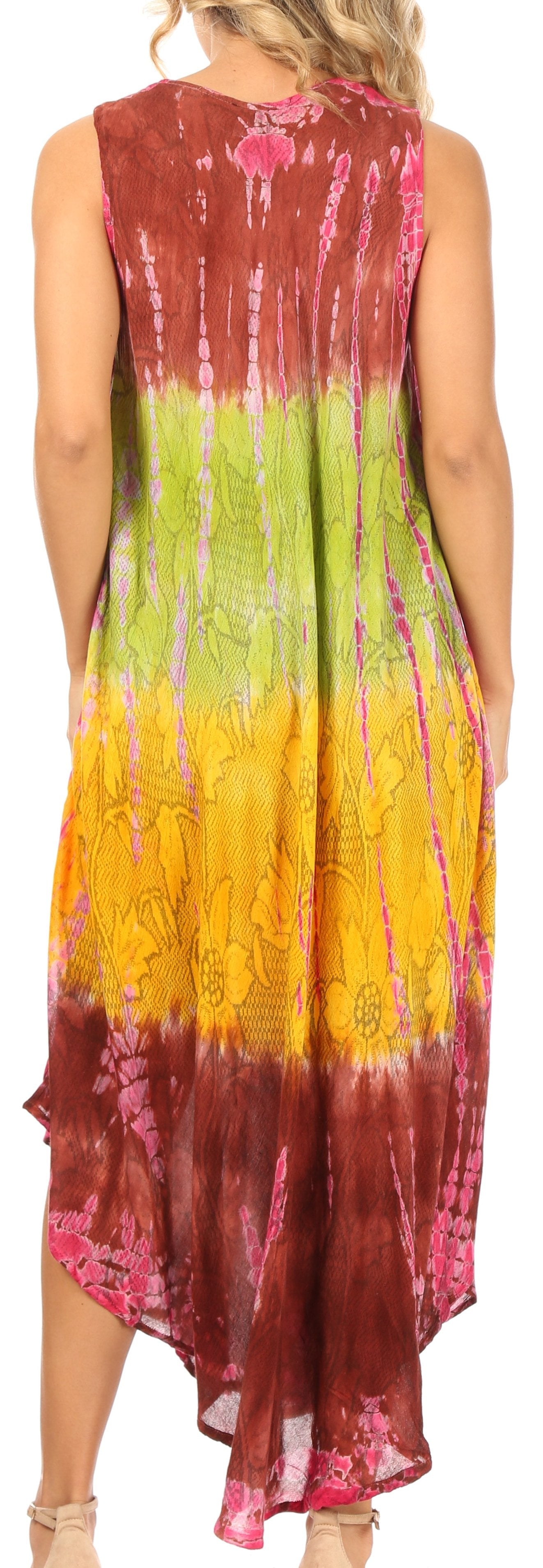 Woman wearing a sleeveless, tie-dye dress with a gradient of colors.