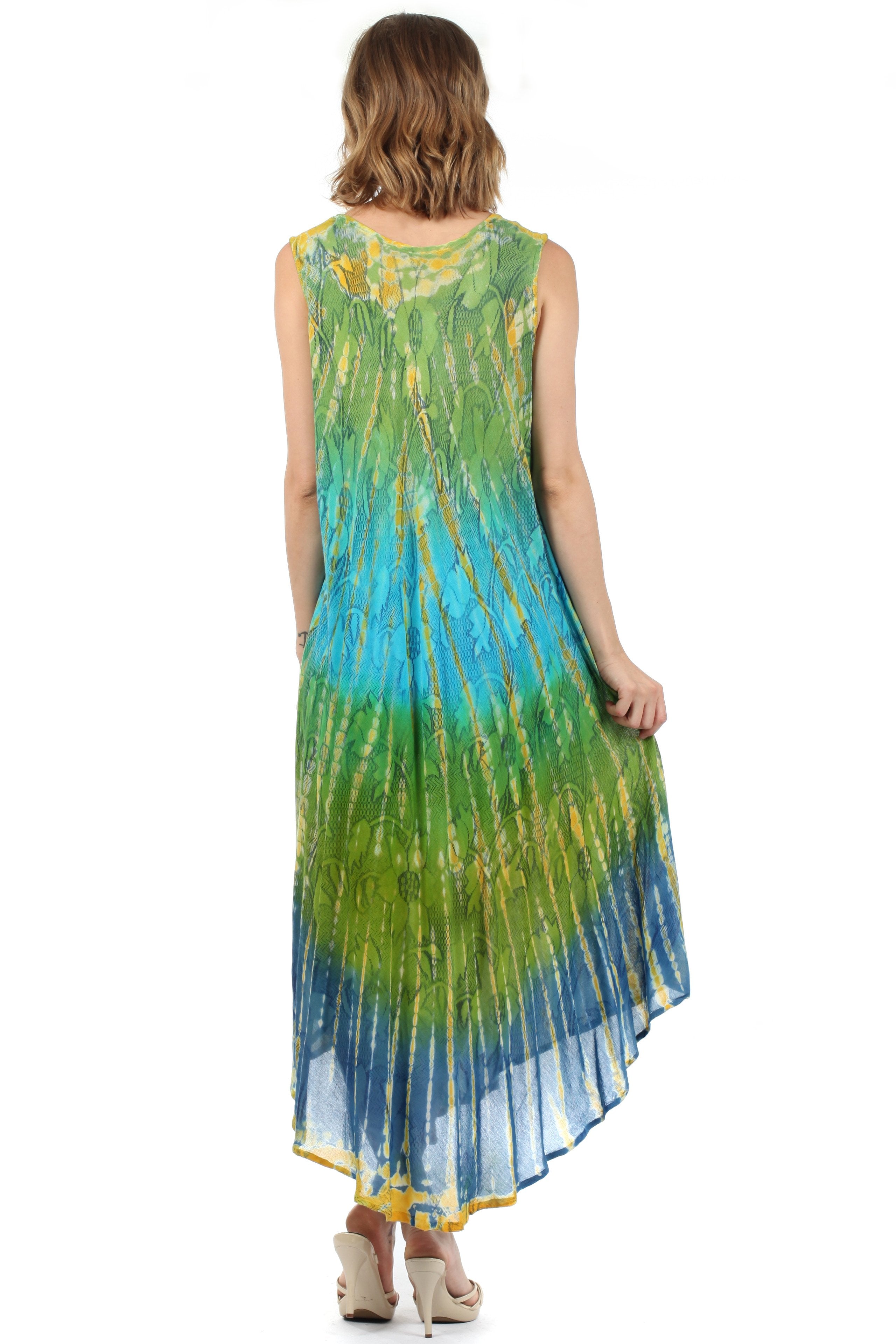 Woman wearing a tie-dye dress with green and blue gradient on a white background