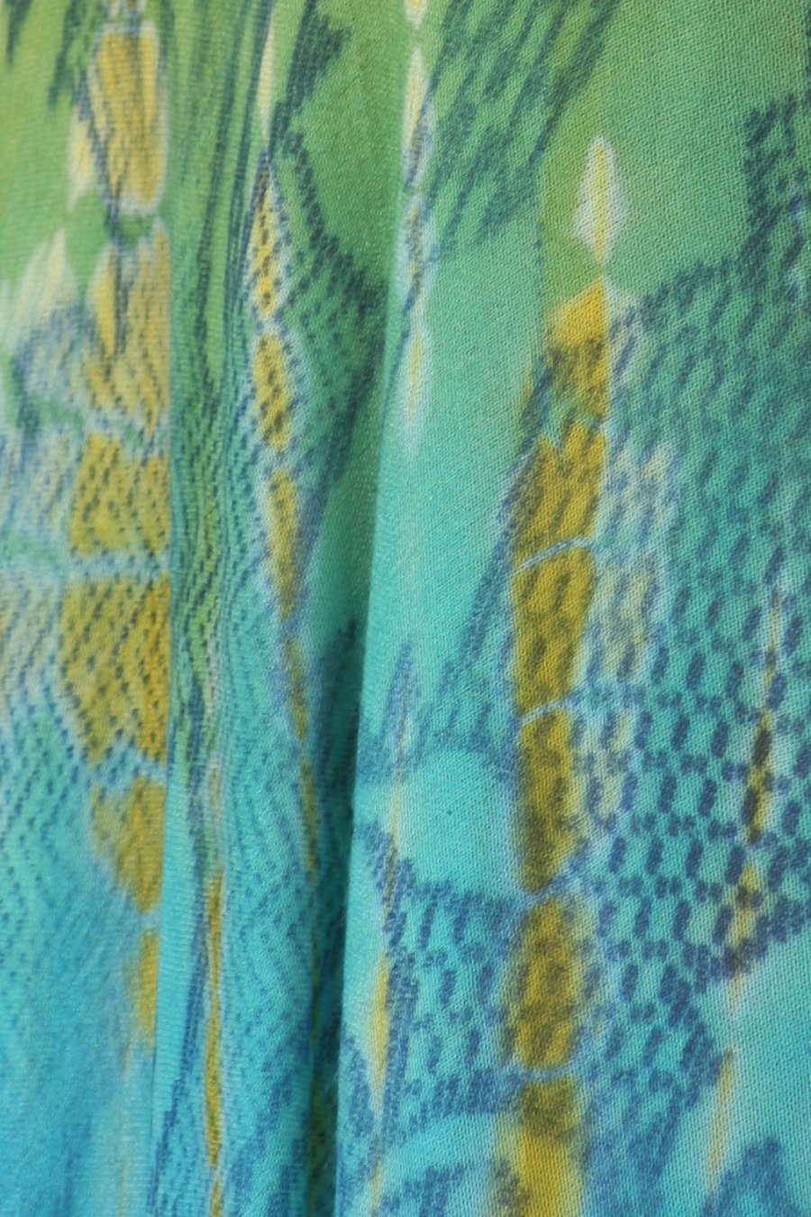 Close-up of fabric with green and blue pattern
