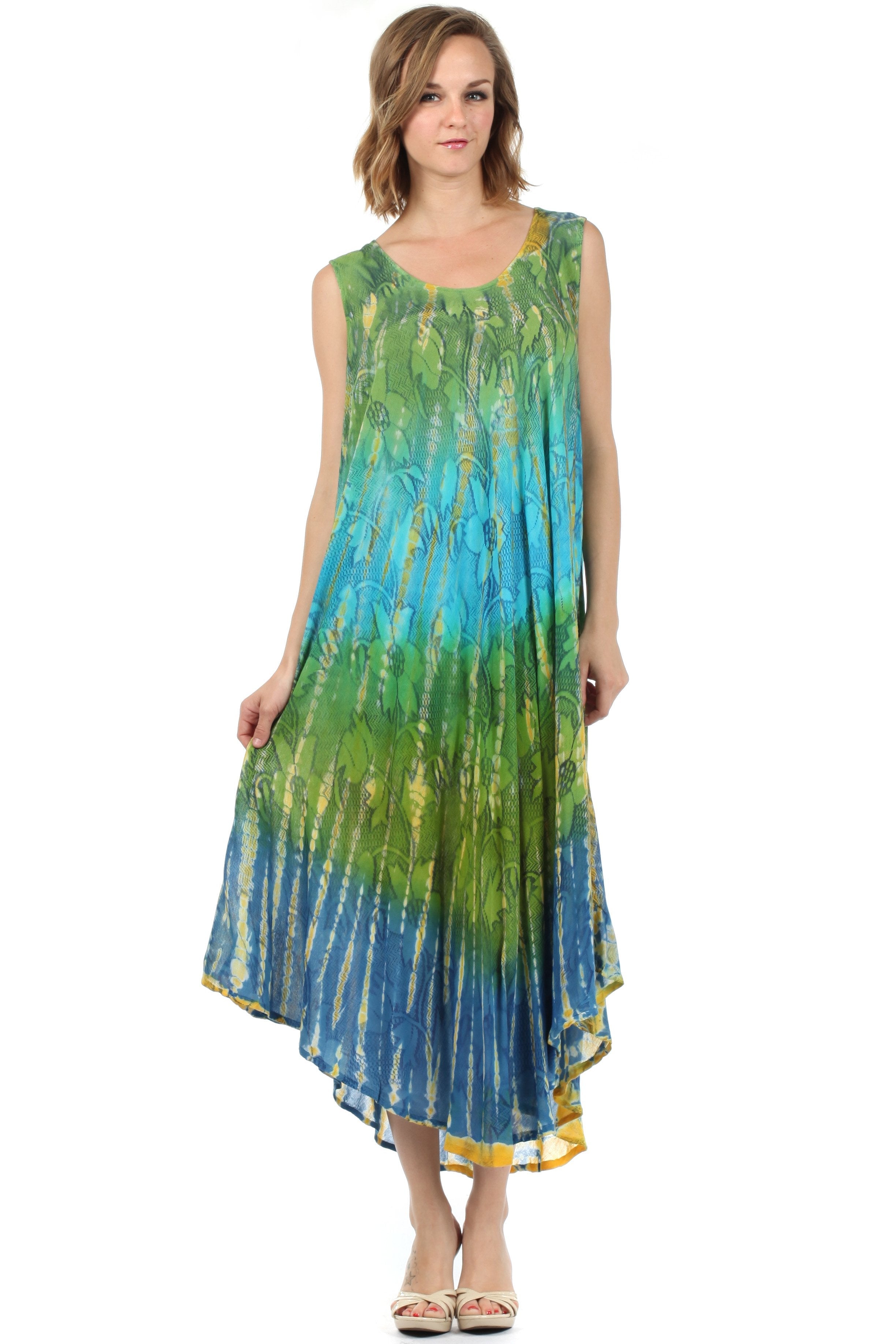 Woman wearing a sleeveless, tie-dye dress with green and blue gradient on a white background