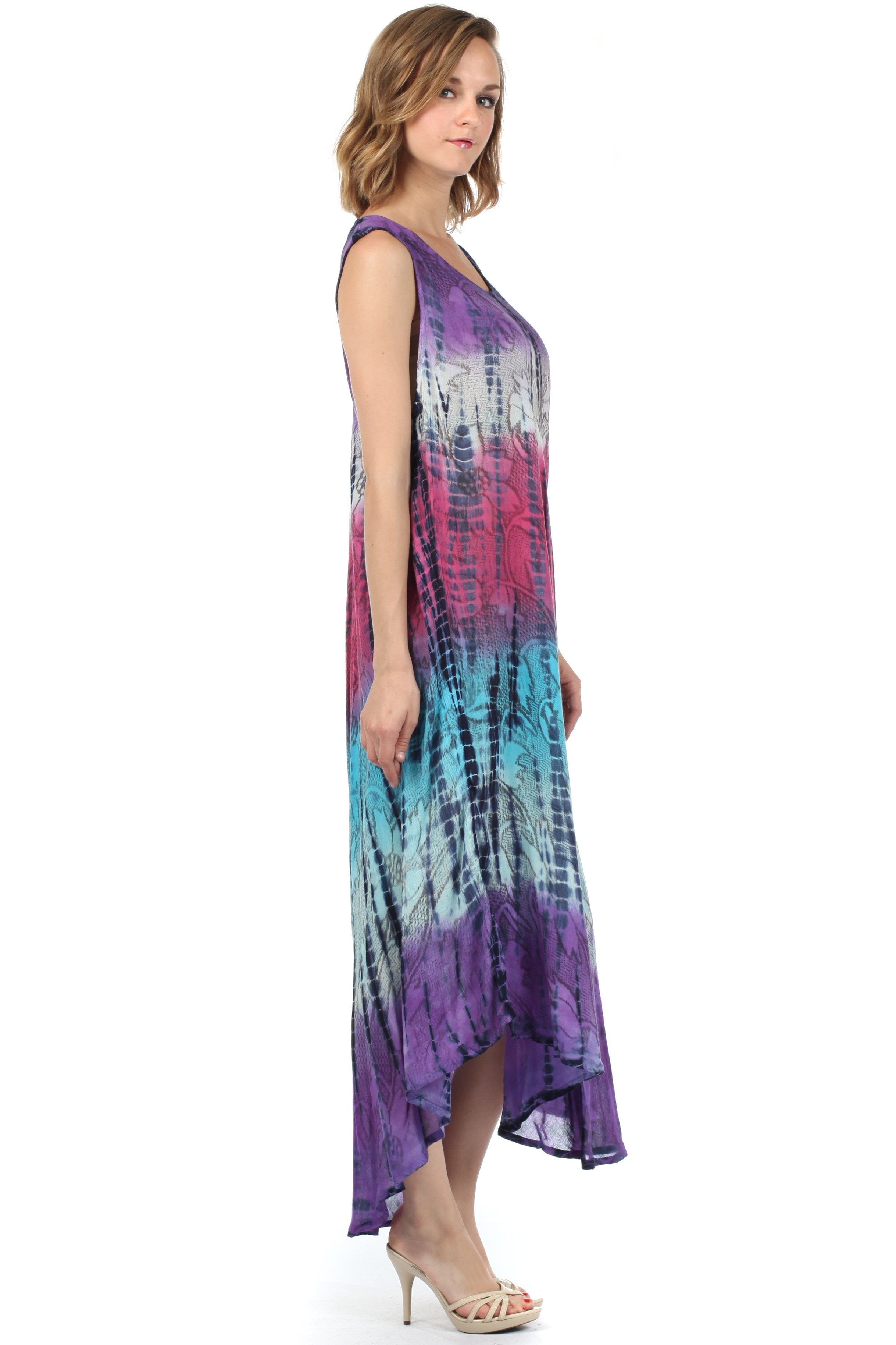 Woman wearing a tie-dye dress on a white background