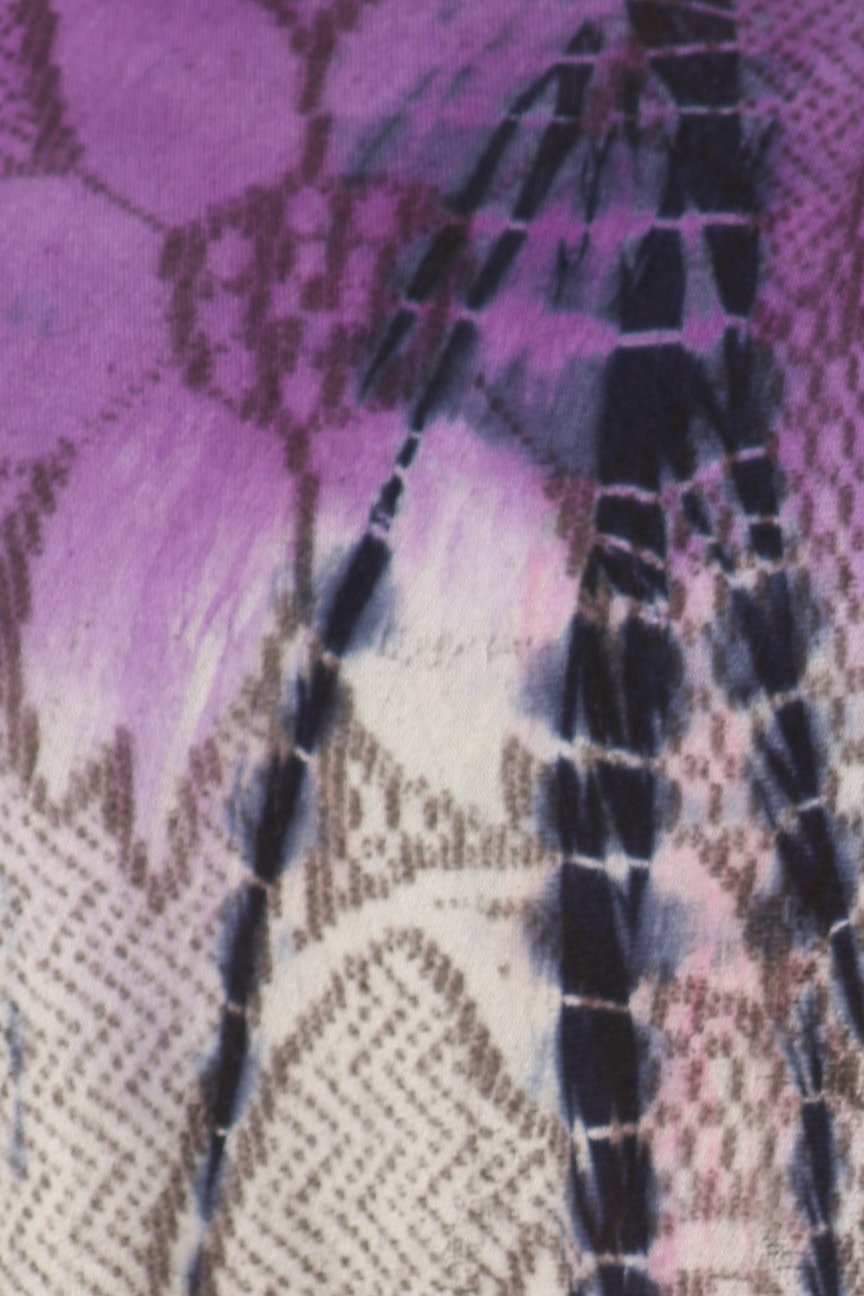 Close-up of a textured fabric with purple and black patterns