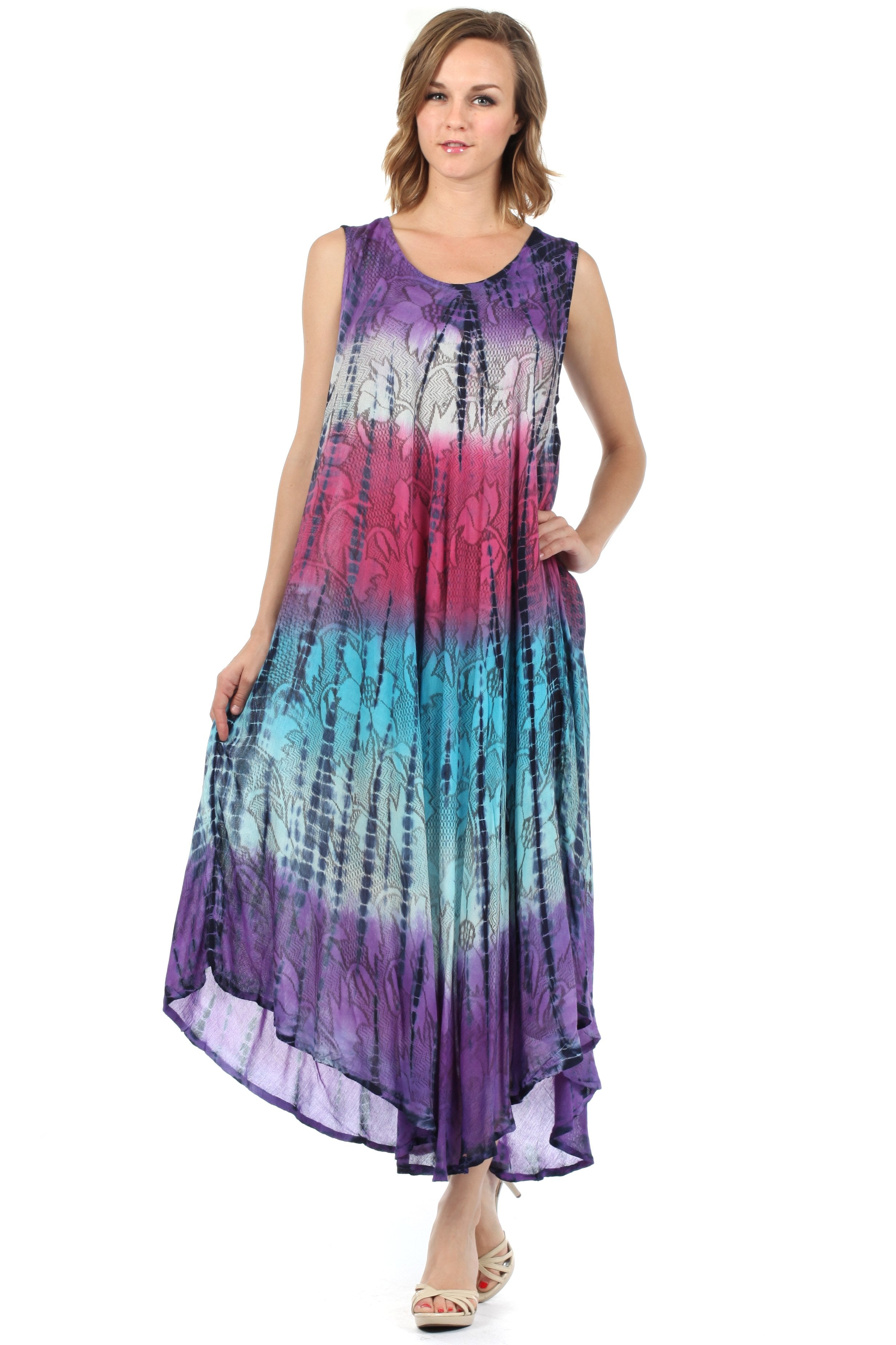Woman wearing a tie-dye dress with a gradient of purple, blue, and pink on a white background.