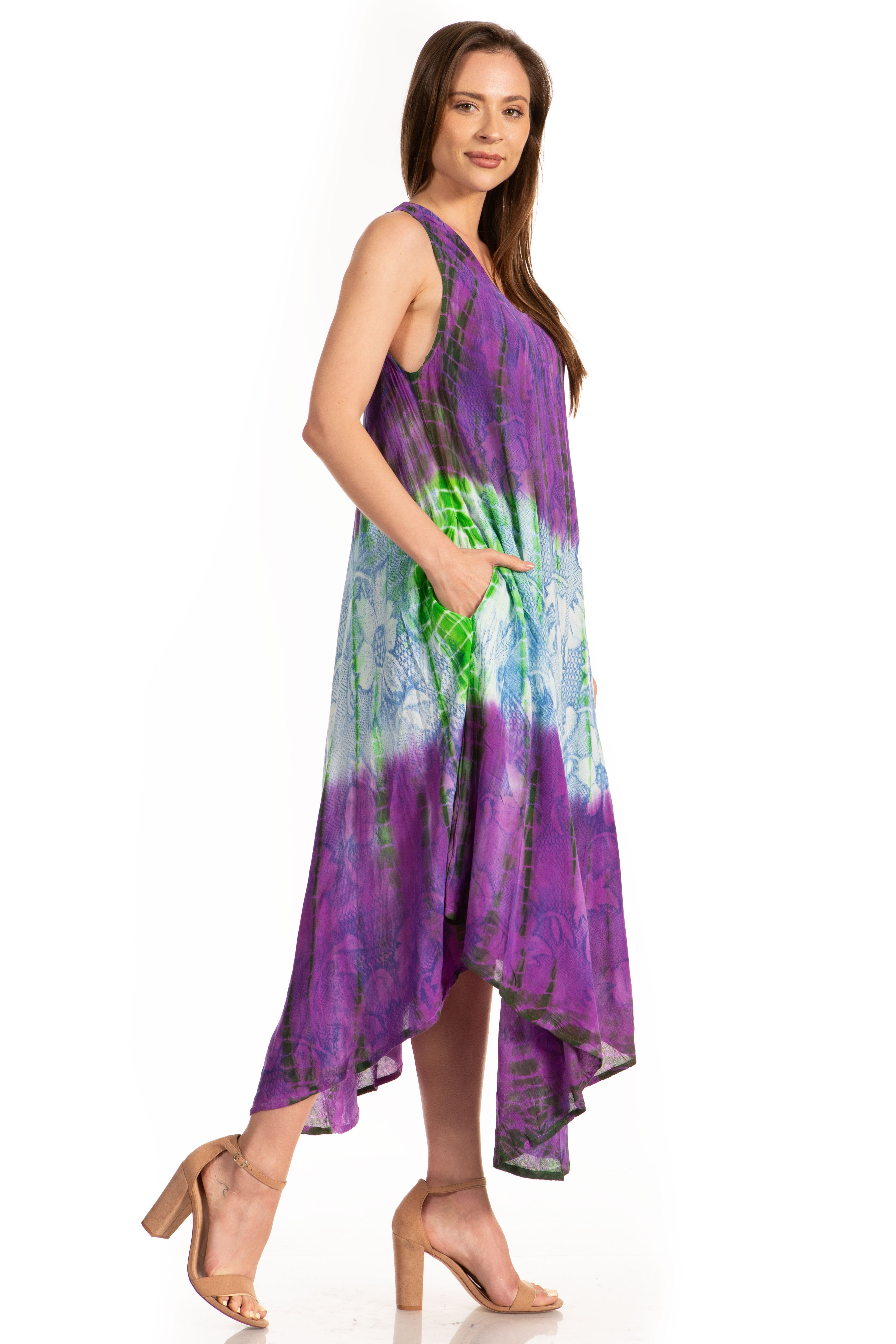Woman wearing a tie-dye dress with purple and green gradient on a white background