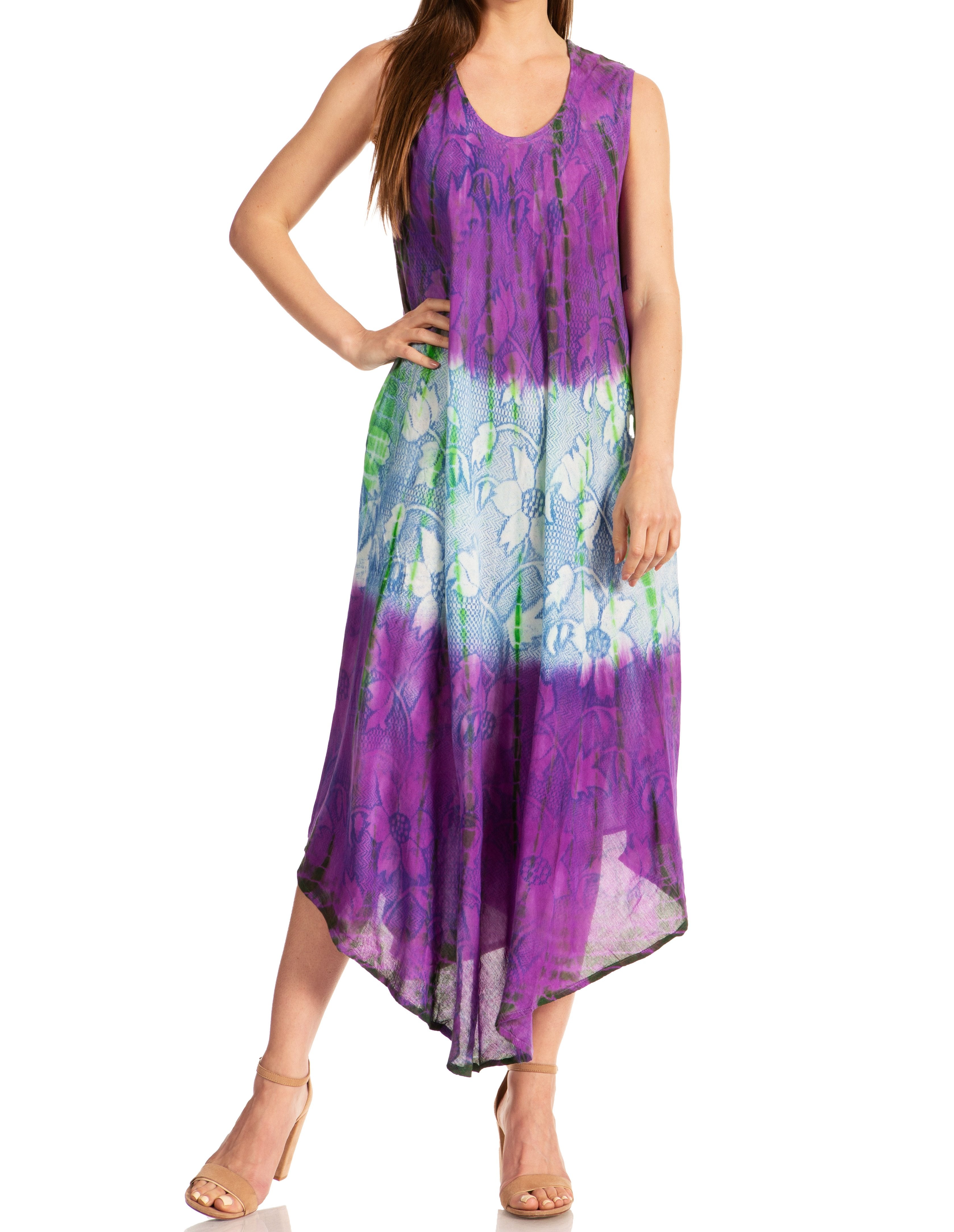 Woman wearing a sleeveless dress with a colorful floral pattern on a white background