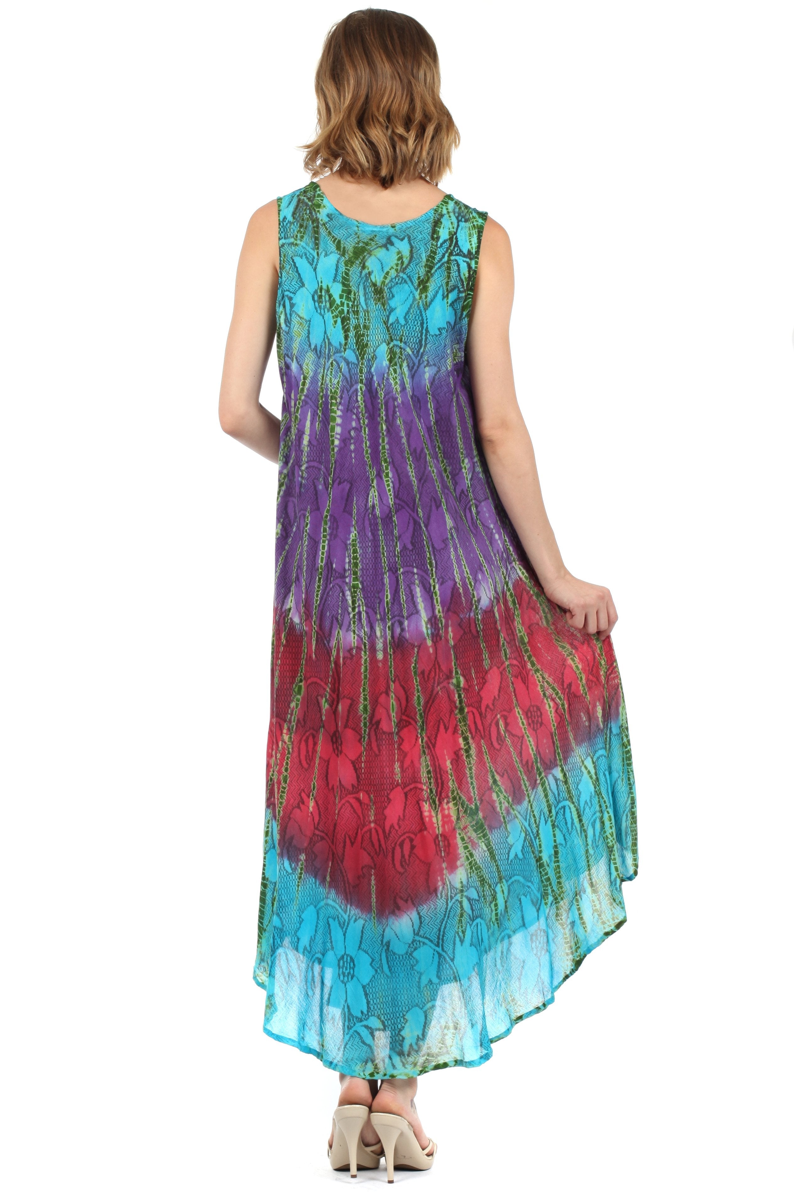 Woman wearing a colorful tie-dye dress on a white background