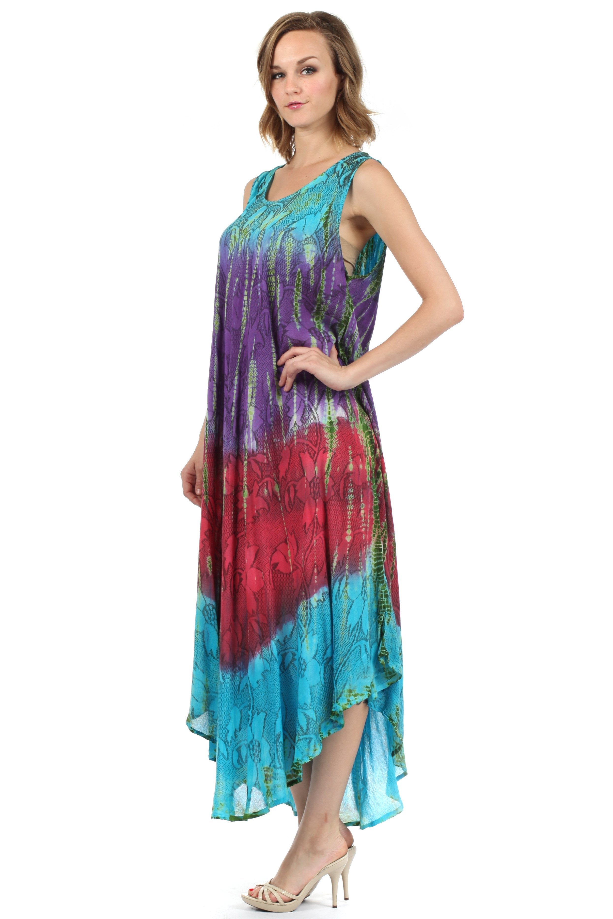 Woman wearing a colorful tie-dye dress on a white background