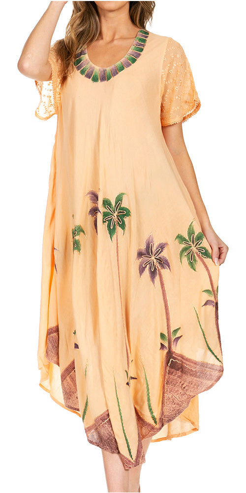 Woman wearing a peach-colored dress with palm tree patterns on a white background