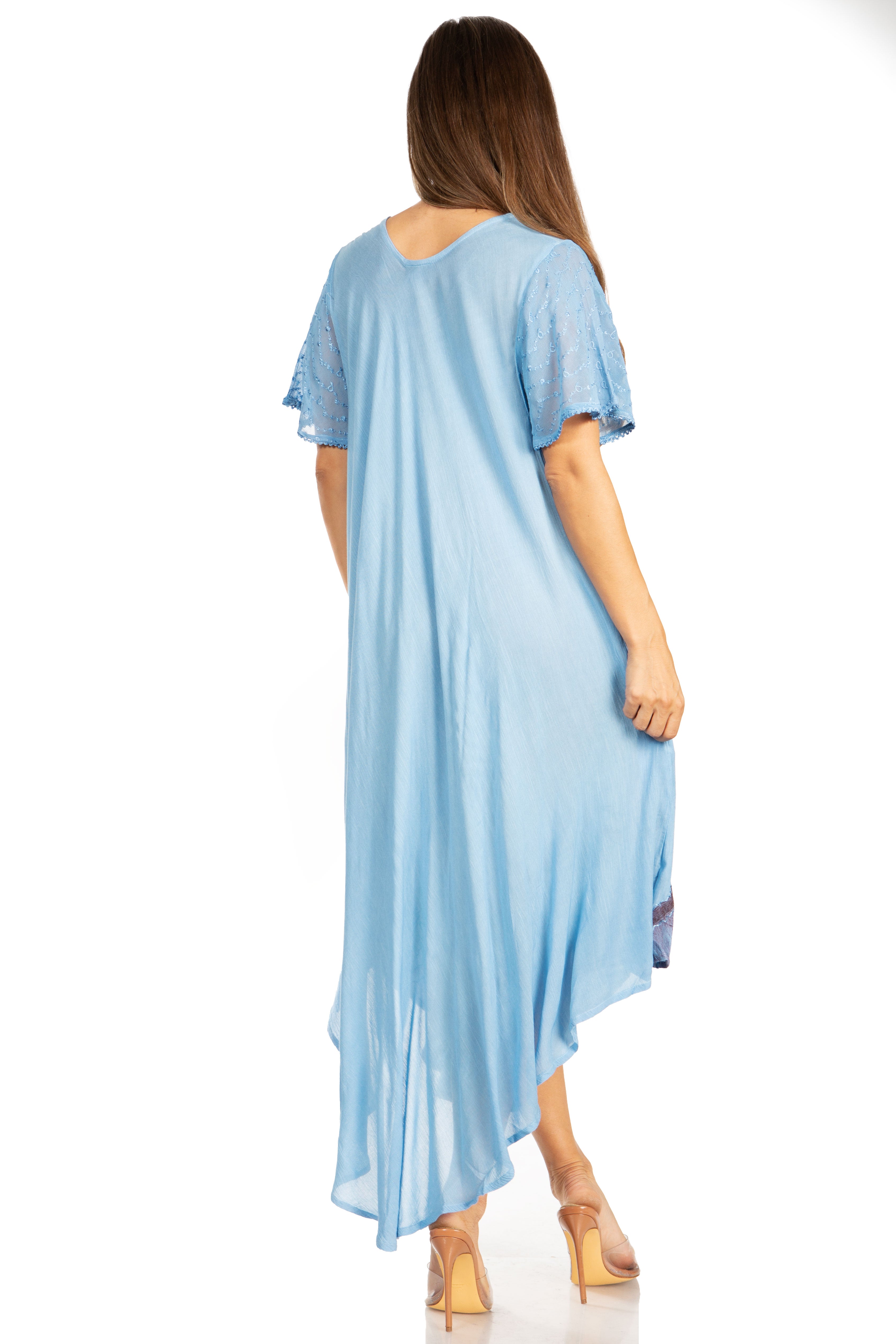 Woman wearing a light blue dress with a white background